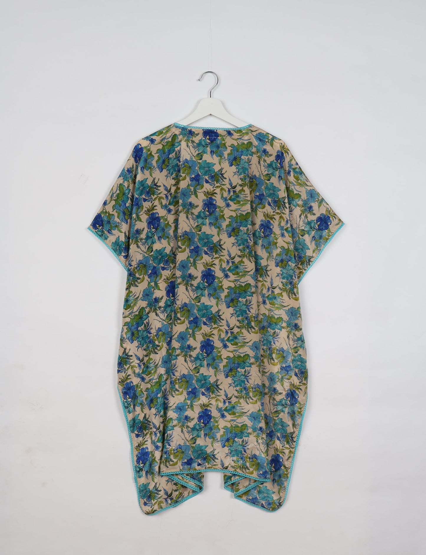 Embrace timeless elegance with our MIDI WRAP DRESS – a midi-length beauty featuring a v-neck, flattery from all angles, and a charming sari belt. Crafted from sustainable materials, this dress embodies ethical clothing and green fashion. Sophisticated with a frill tier at the hem and short cap sleeves, this dress is perfect for any occasion. Tie up the beautifully crafted sari belt on the side for a versatile, stylish, and eco-friendly look.