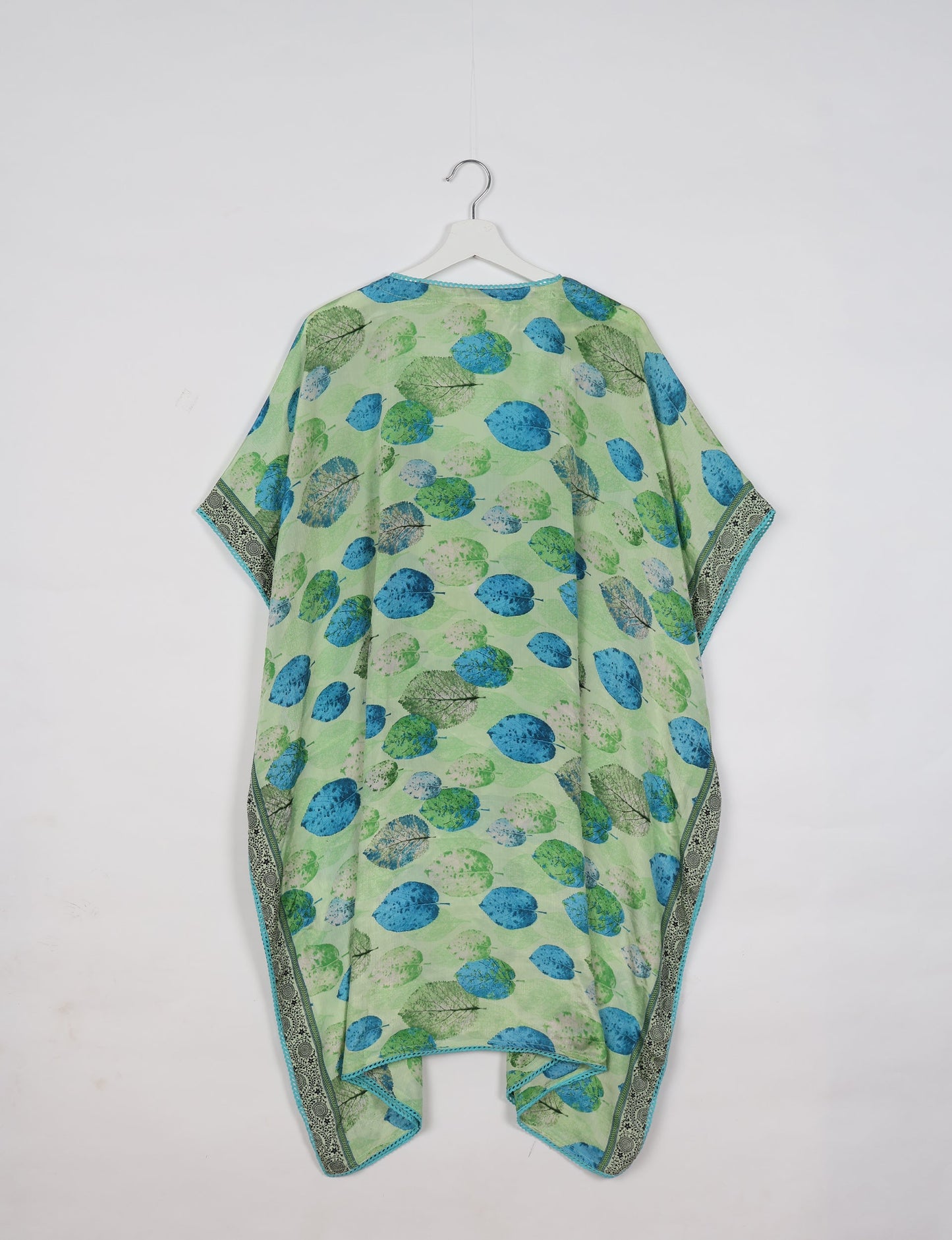 Embrace timeless elegance with our MIDI WRAP DRESS – a midi-length beauty featuring a v-neck, flattery from all angles, and a charming sari belt. Crafted from sustainable materials, this dress embodies ethical clothing and green fashion. Sophisticated with a frill tier at the hem and short cap sleeves, this dress is perfect for any occasion. Tie up the beautifully crafted sari belt on the side for a versatile, stylish, and eco-friendly look.