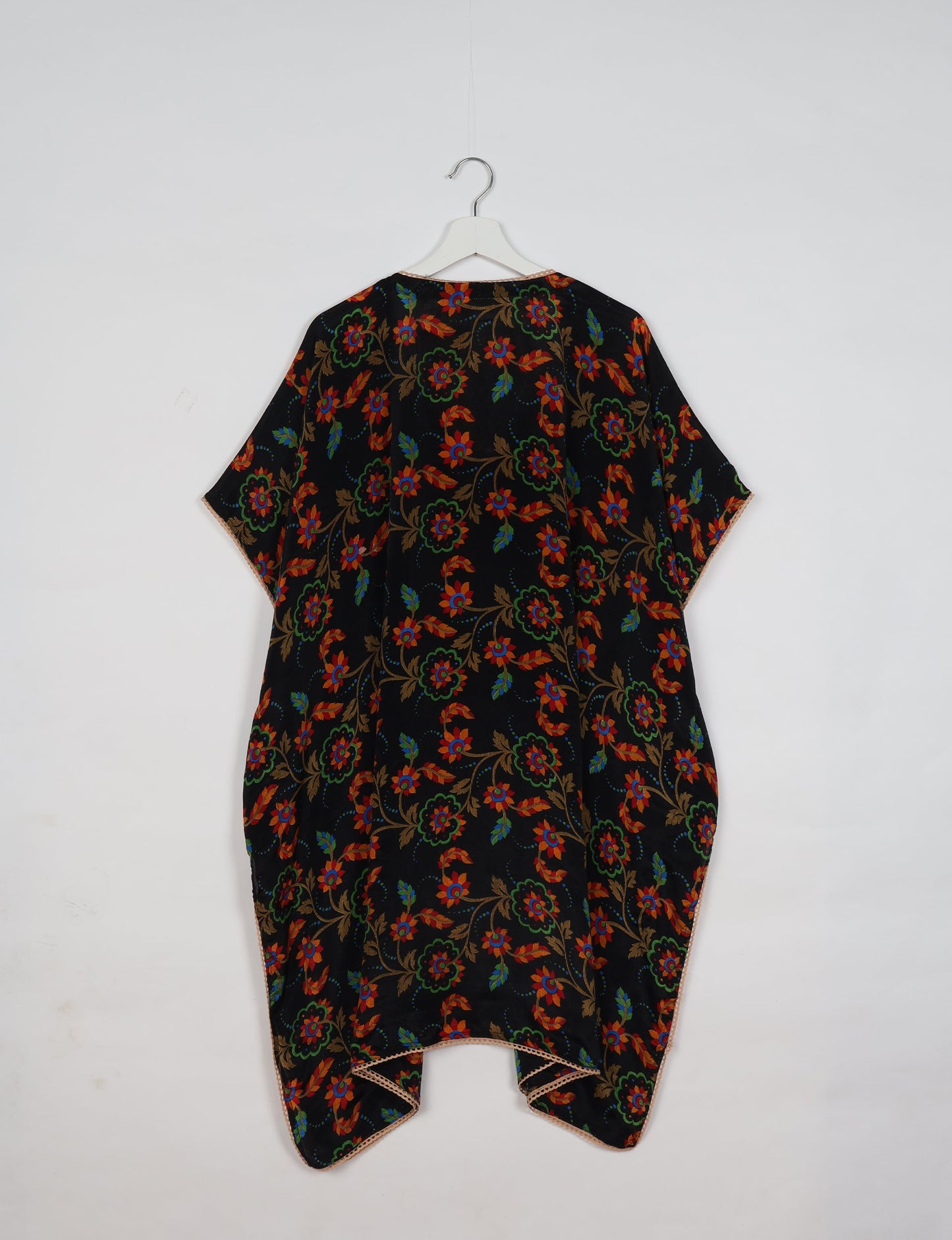 Embrace timeless elegance with our MIDI WRAP DRESS – a midi-length beauty featuring a v-neck, flattery from all angles, and a charming sari belt. Crafted from sustainable materials, this dress embodies ethical clothing and green fashion. Sophisticated with a frill tier at the hem and short cap sleeves, this dress is perfect for any occasion. Tie up the beautifully crafted sari belt on the side for a versatile, stylish, and eco-friendly look.