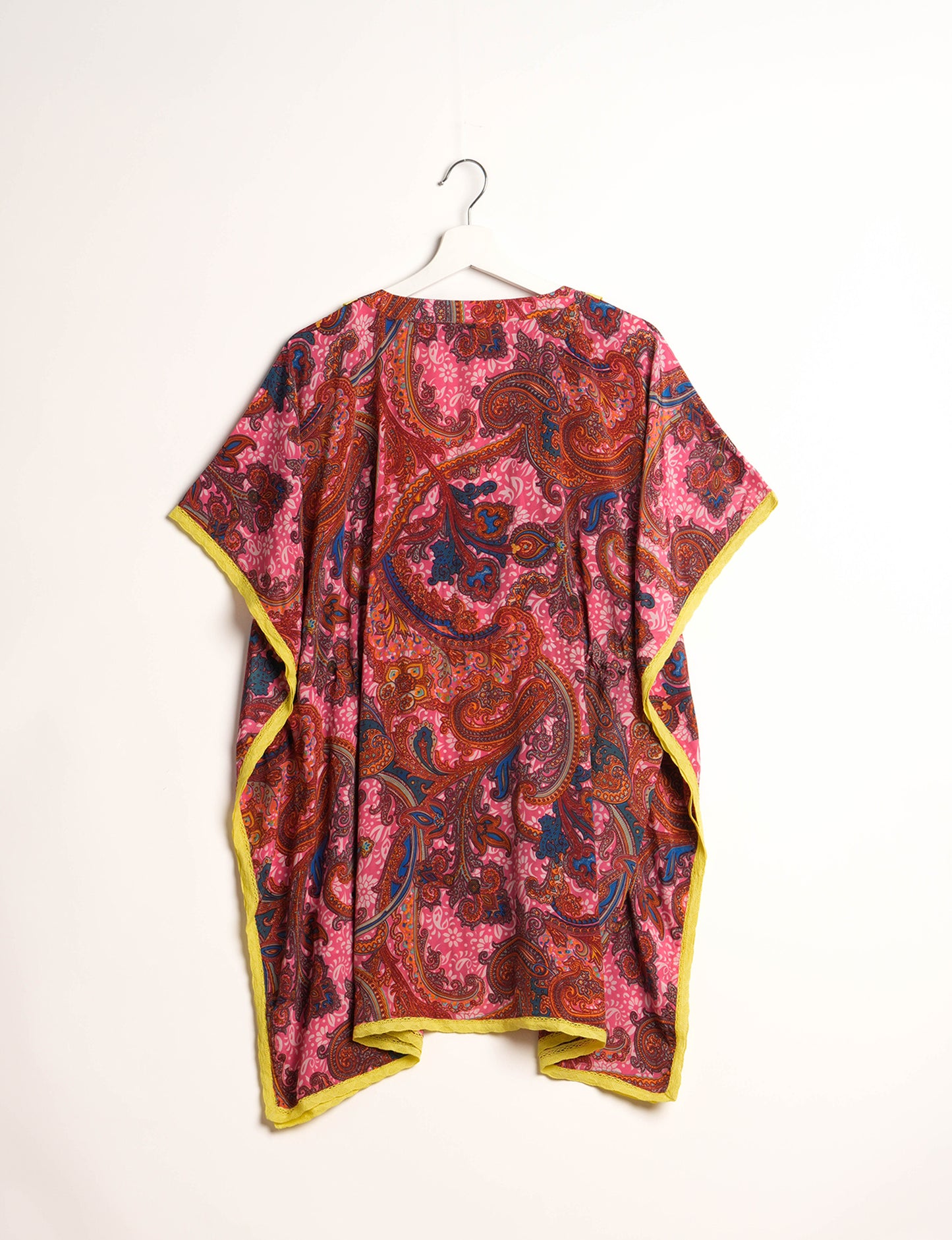 Elevate your style with our short kaftan, a perfect blend of ethical and green fashion. The light and loose-flowing fabric, drawstring waist, beaded tassel ends, and delicate lace edging make it a versatile choice for urban summers, beachwear, or poolside elegance. Enjoy sustainable and fashionable living.