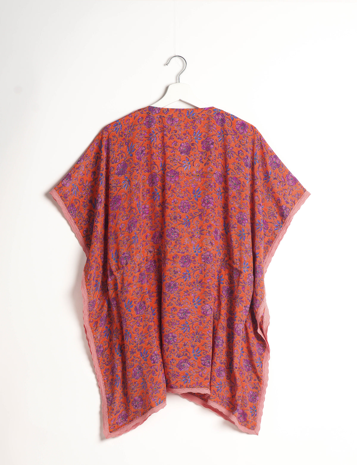 Elevate your style with our short kaftan, a perfect blend of ethical and green fashion. The light and loose-flowing fabric, drawstring waist, beaded tassel ends, and delicate lace edging make it a versatile choice for urban summers, beachwear, or poolside elegance. Enjoy sustainable and fashionable living.