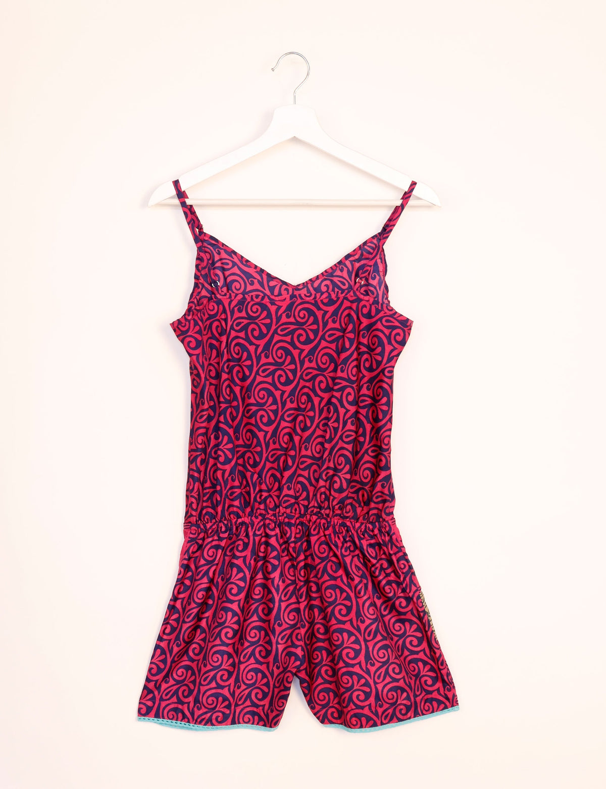 Vibrant playsuit with lace accents, crafted from upcycled saris. Embrace ethical fashion with this unique piece designed for conscious consumers.