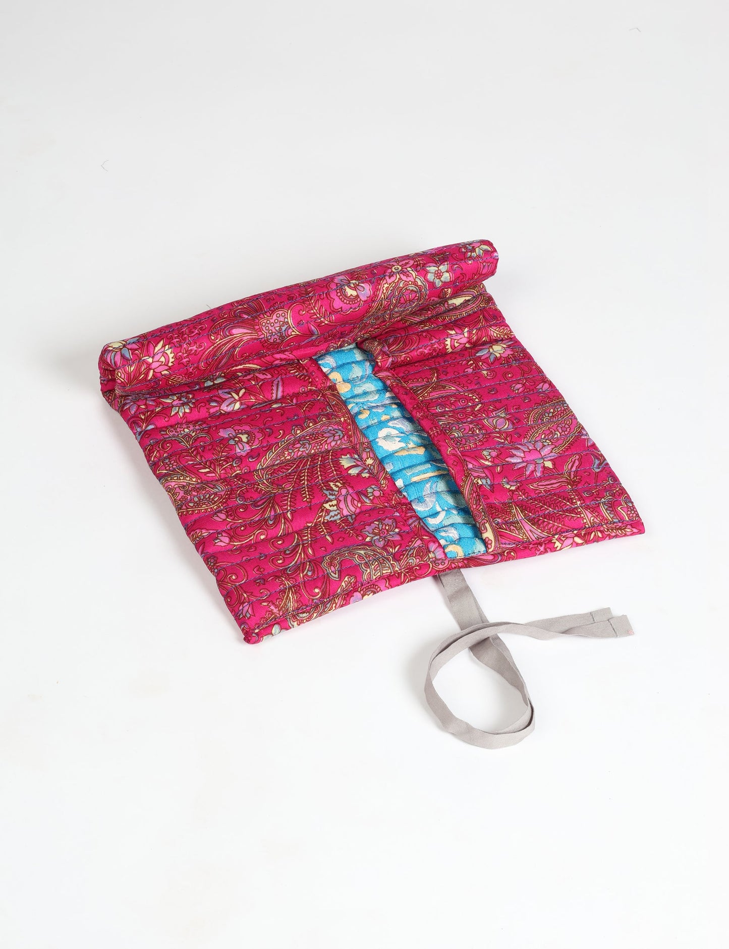 Roll-Up Organizer made from repurposed sari fabric, showcasing compact design and sustainable fashion innovation.