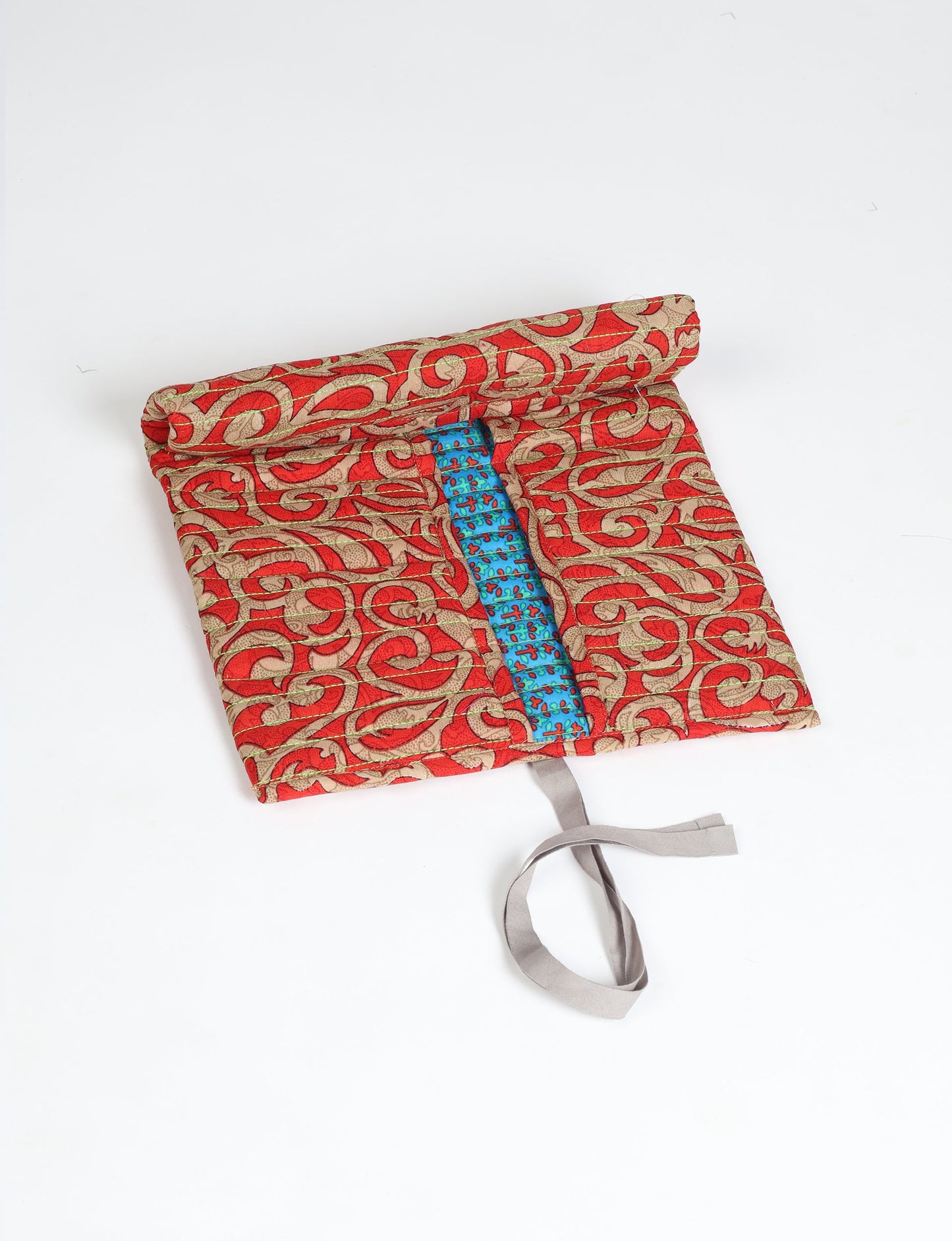 Roll-Up Organizer made from repurposed sari fabric, showcasing compact design and sustainable fashion innovation.