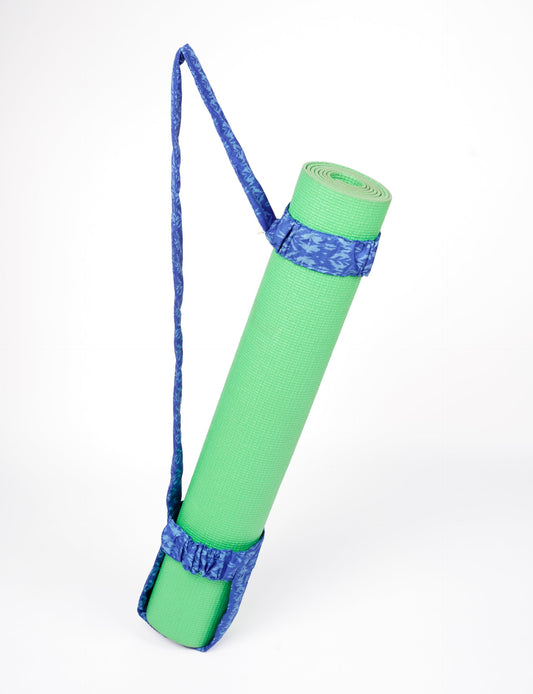 A green yoga mat holder made from upcycled materials, embodying ethical and sustainable fashion ideals.