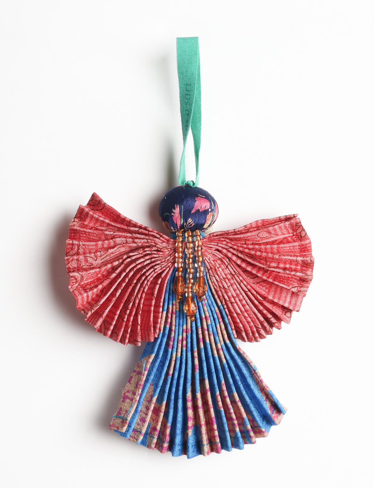 Angel Christmas Ornament made from upcycled saris, featuring pleated arms and body. A sustainable, eco-friendly holiday decoration, embodying recycled fashion and upcycling in festive style.