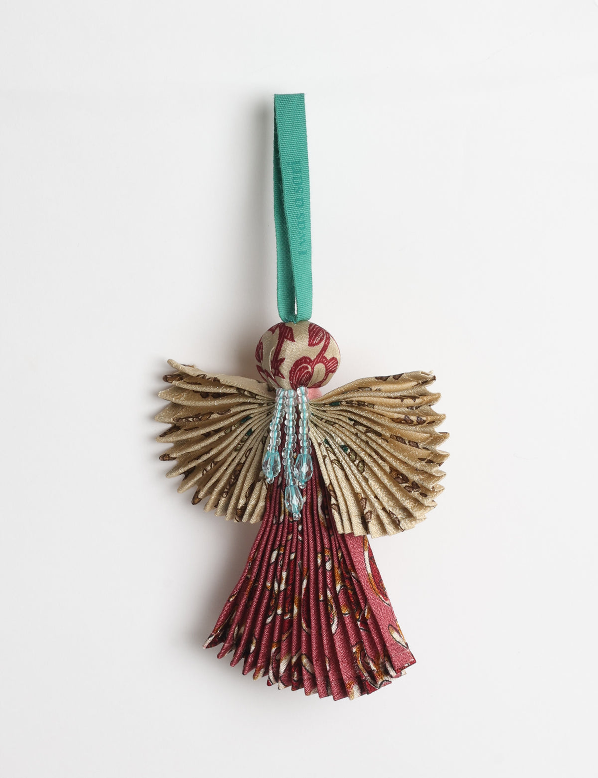 Angel Christmas Ornament made from upcycled saris, featuring pleated arms and body. A sustainable, eco-friendly holiday decoration, embodying recycled fashion and upcycling in festive style.