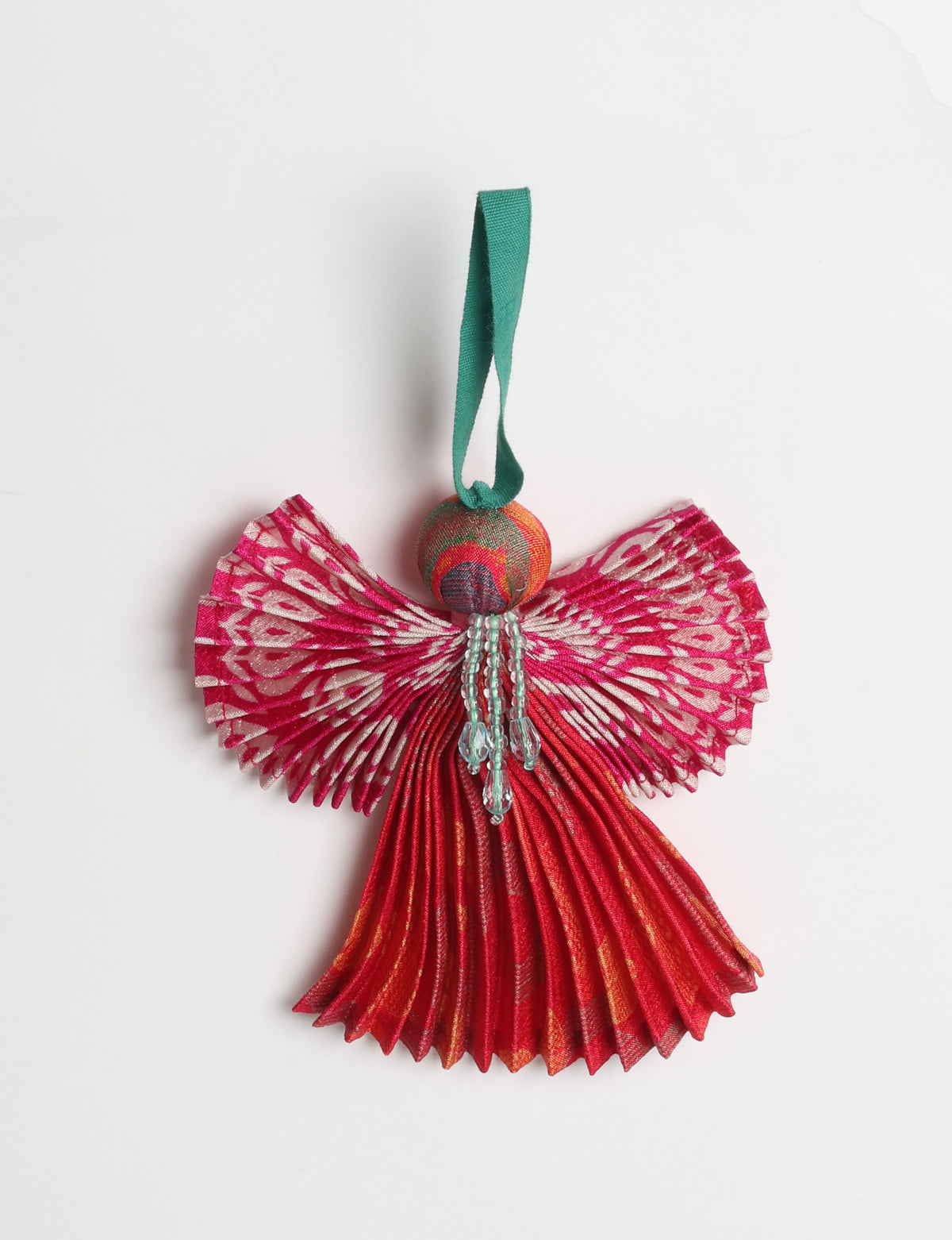 Angel Christmas Ornament made from upcycled saris, featuring pleated arms and body. A sustainable, eco-friendly holiday decoration, embodying recycled fashion and upcycling in festive style.