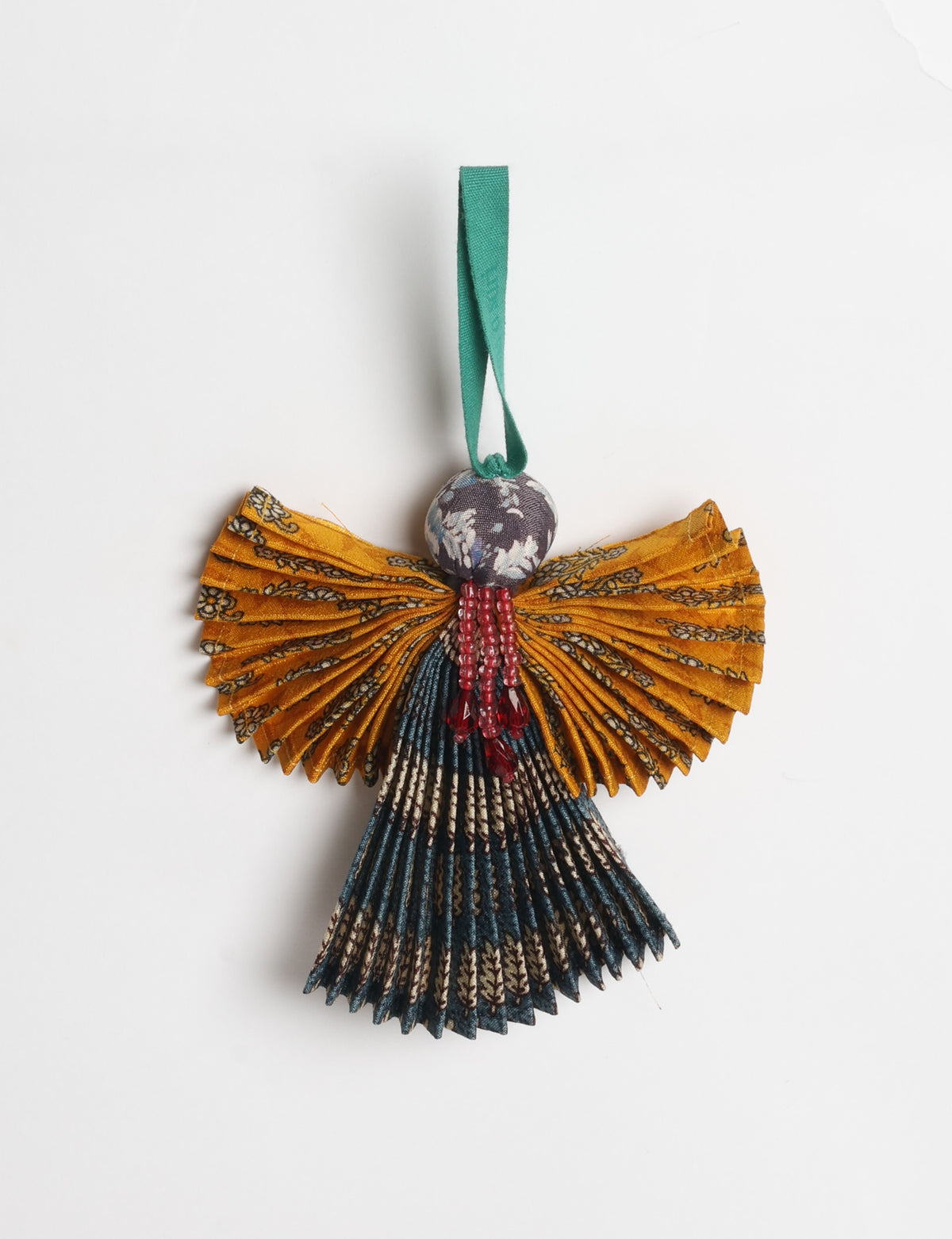 Angel Christmas Ornament made from upcycled saris, featuring pleated arms and body. A sustainable, eco-friendly holiday decoration, embodying recycled fashion and upcycling in festive style.