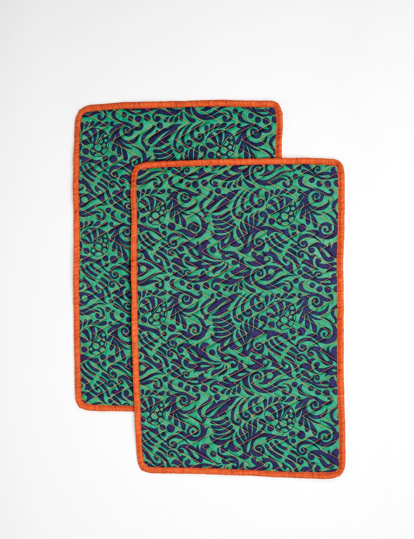 Quilted rectangular placement set of 2 made from upcycled saris and cotton canvas, eco-friendly dining accessories for ethical consumers.