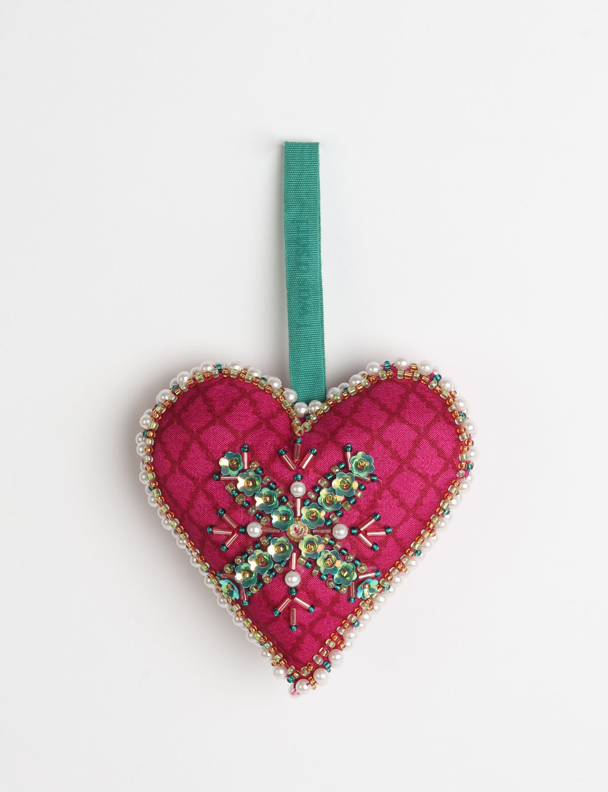 Red fabric heart ornament with yellow floral print, green and pearl bead embellishments, and green hanging loop