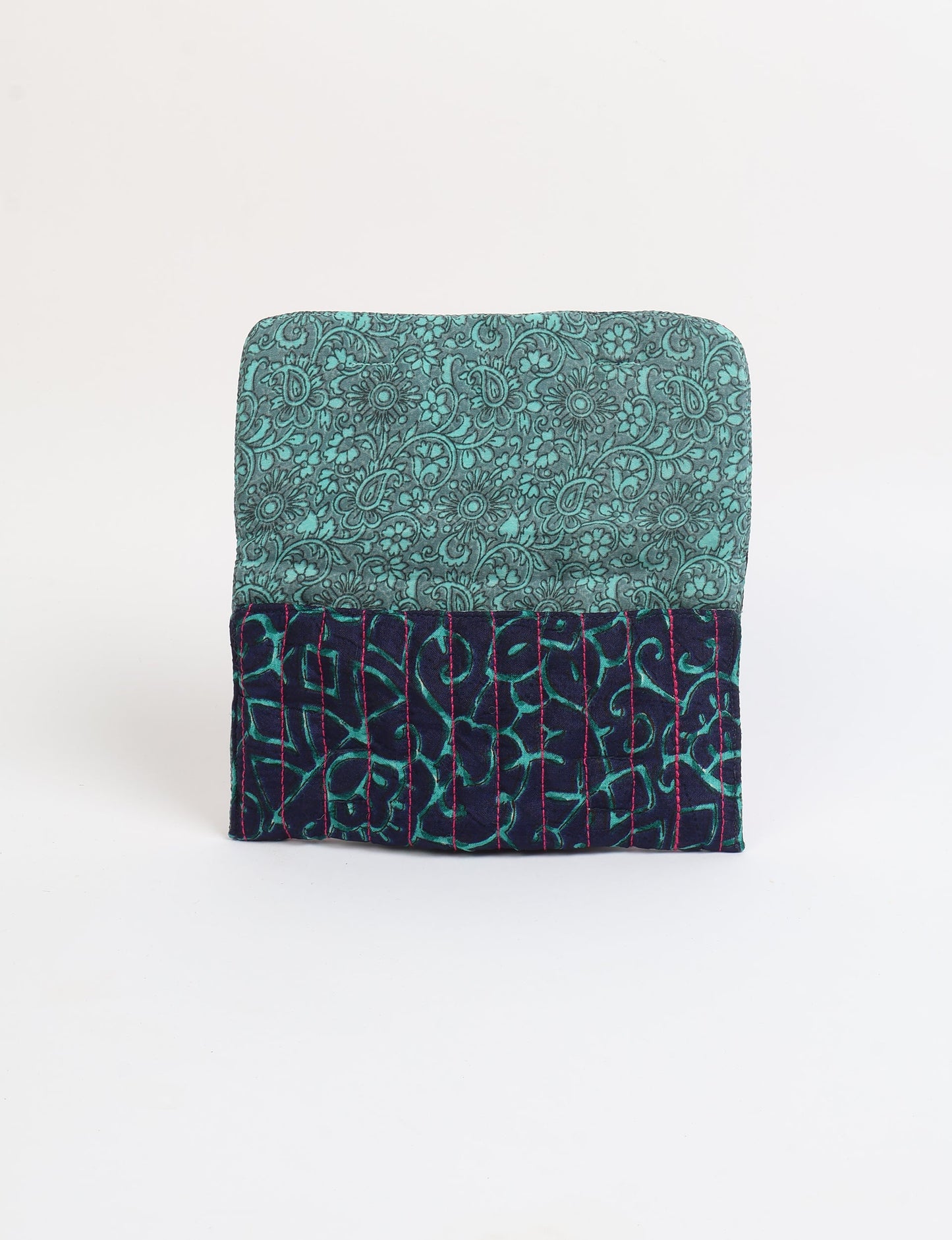 Quilted sunglasses case made from recycled sari products, featuring a secure magnetic closure. A chic example of ethical fashion, conscious clothing, and carbon neutral fashion. Protect your sunglasses while embracing circular fashion and upcycled garments.