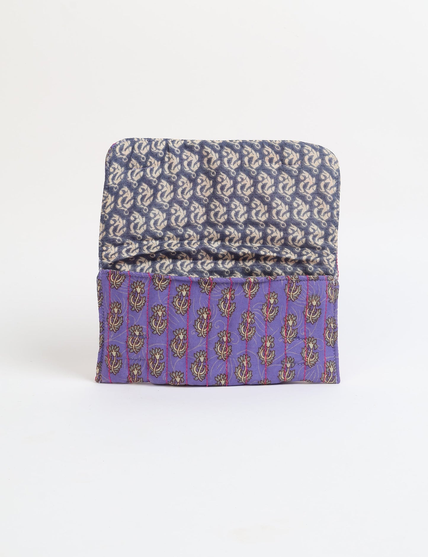 Quilted sunglasses case made from recycled sari products, featuring a secure magnetic closure. A chic example of ethical fashion, conscious clothing, and carbon neutral fashion. Protect your sunglasses while embracing circular fashion and upcycled garments.