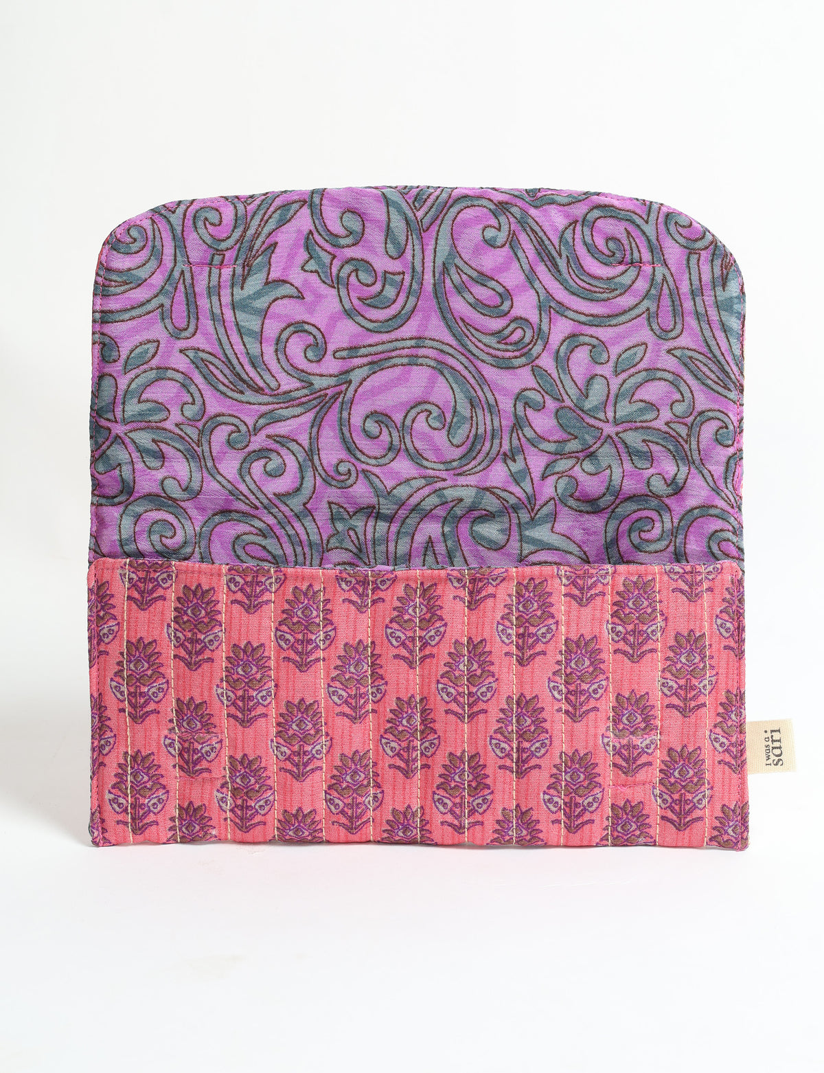 Quilted sunglasses case with pink floral pattern exterior and purple swirling leaf pattern interior, flat open view with