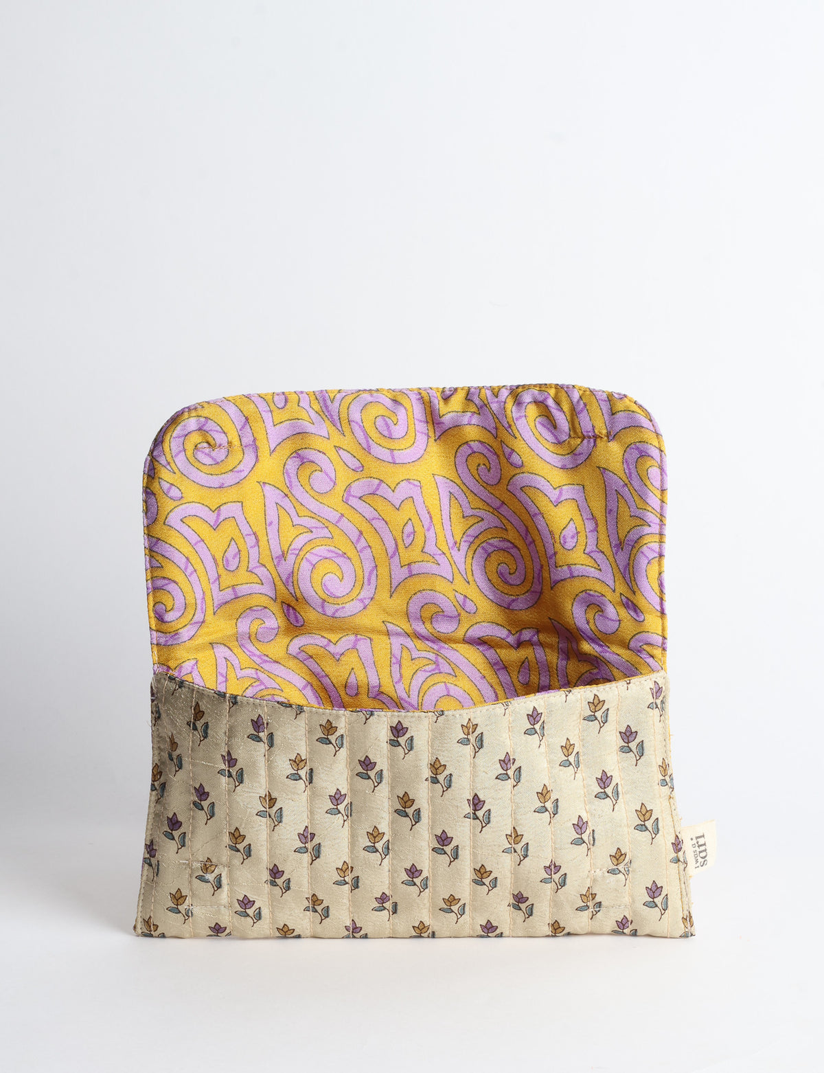 Quilted sunglasses case made from recycled sari products, featuring a secure magnetic closure. A chic example of ethical fashion, conscious clothing, and carbon neutral fashion. Protect your sunglasses while embracing circular fashion and upcycled garments.