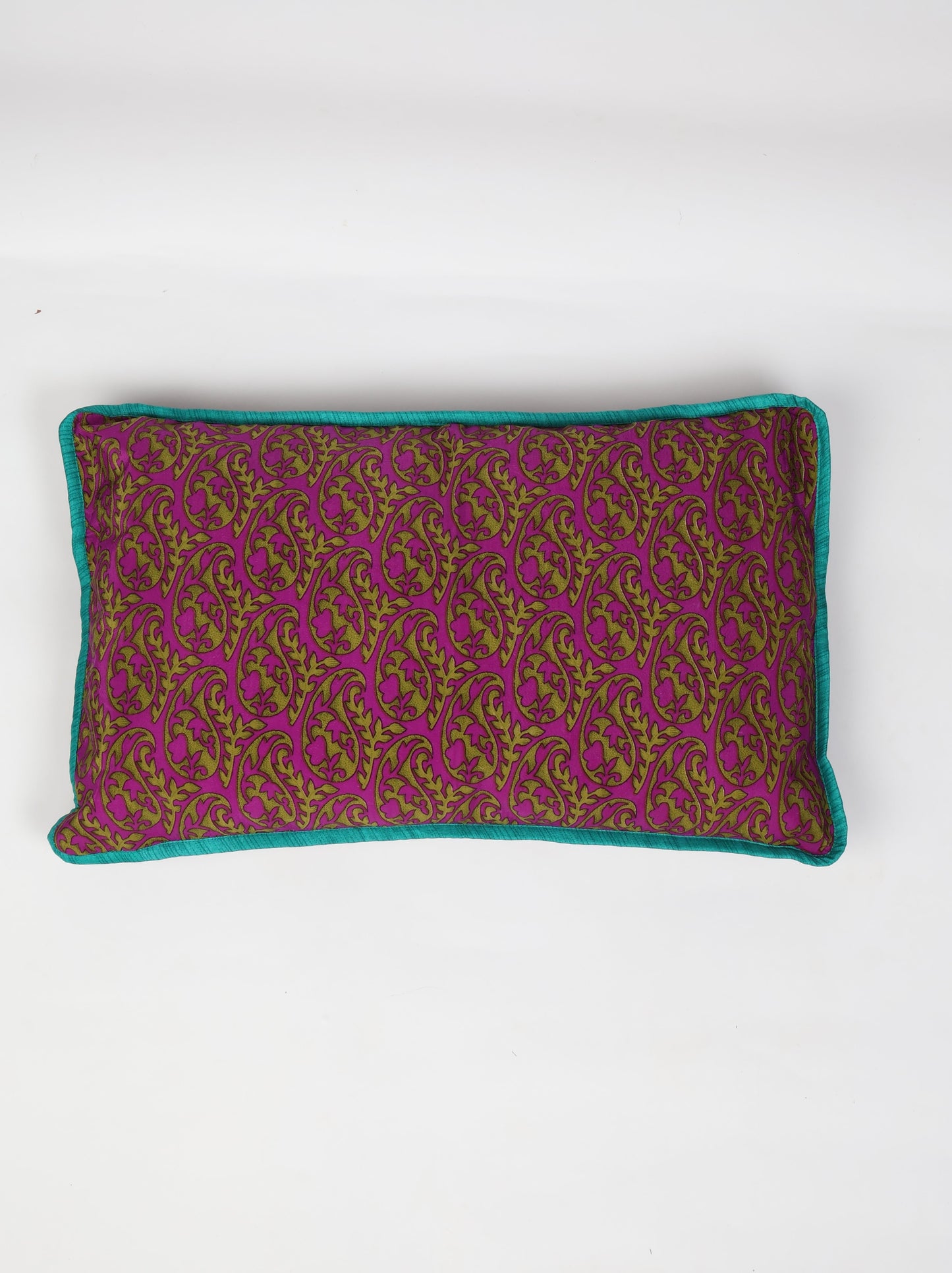 An eco-friendly Lumbar Cushion Cover with piping edge made from recycled saris. Featuring a stylish five-button closure, this sustainable fashion piece highlights upcycled women's clothing, eco-friendly cloth, carbon-neutral fashion, and natural clothing. A beautiful recycled sari product promoting climate-neutral and environmentally friendly clothing.