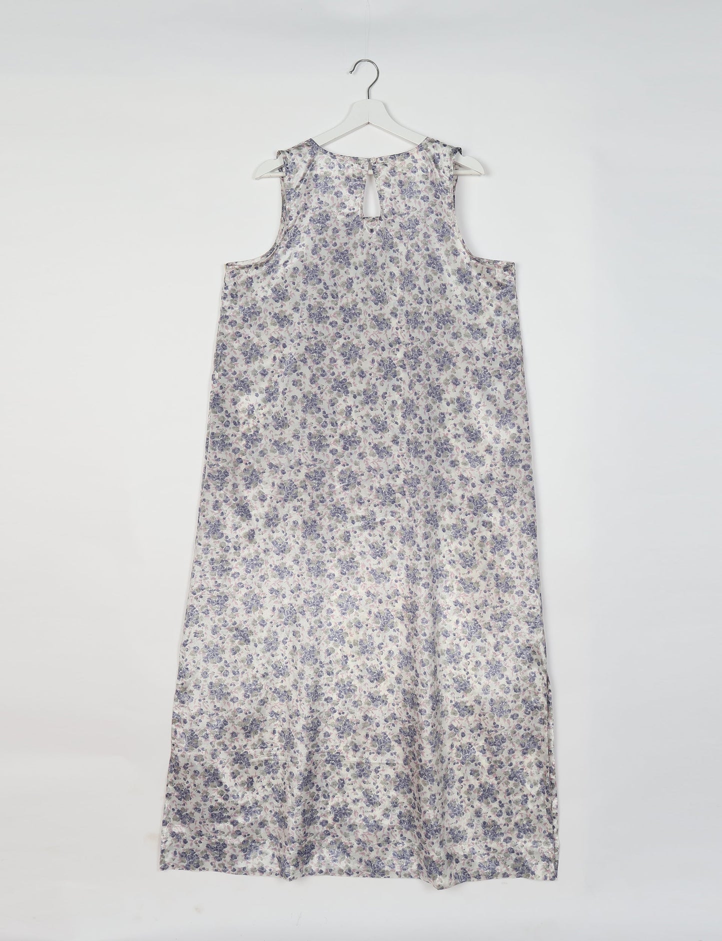 Sleeveless A-Line maxi dress made from recycled saris, showcasing eco clothing and green fashion. A chic example of upcycled women's clothing and climate neutral clothing, perfect for fans of circular fashion, carbon neutral fashion, and products made from textile waste.