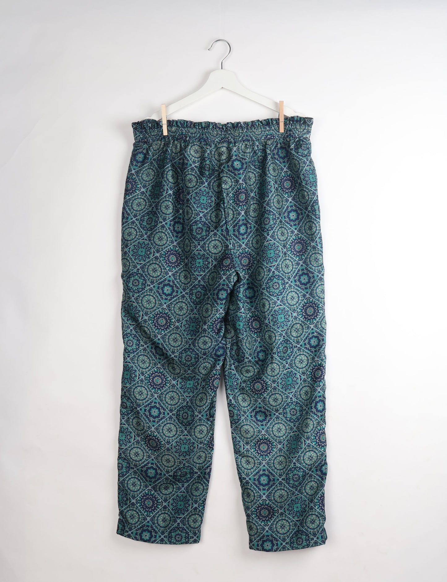 Paperbag high waisted pull-on pants for women made from upcycled garments and recycled fabric, featuring eco clothing design with an elasticated waistband and side pockets. A beautiful example of sustainable women’s clothing and environmentally friendly clothing inspired by upcycling fashion and green fashion movements.