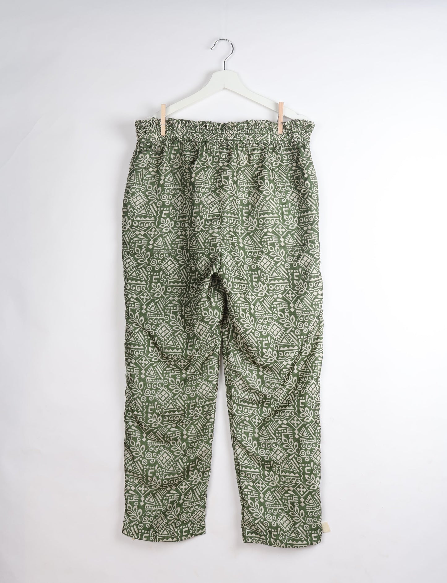 Paperbag high waisted pull-on pants for women made from upcycled garments and recycled fabric, featuring eco clothing design with an elasticated waistband and side pockets. A beautiful example of sustainable women’s clothing and environmentally friendly clothing inspired by upcycling fashion and green fashion movements.