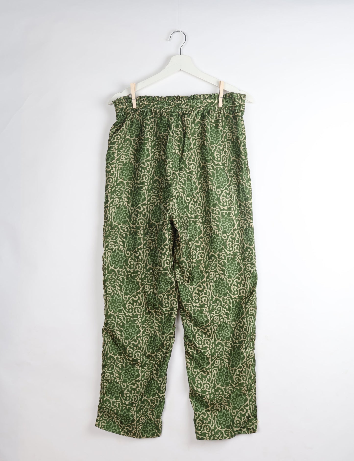 Paperbag high waisted pull-on pants for women made from upcycled garments and recycled fabric, featuring eco clothing design with an elasticated waistband and side pockets. A beautiful example of sustainable women’s clothing and environmentally friendly clothing inspired by upcycling fashion and green fashion movements.