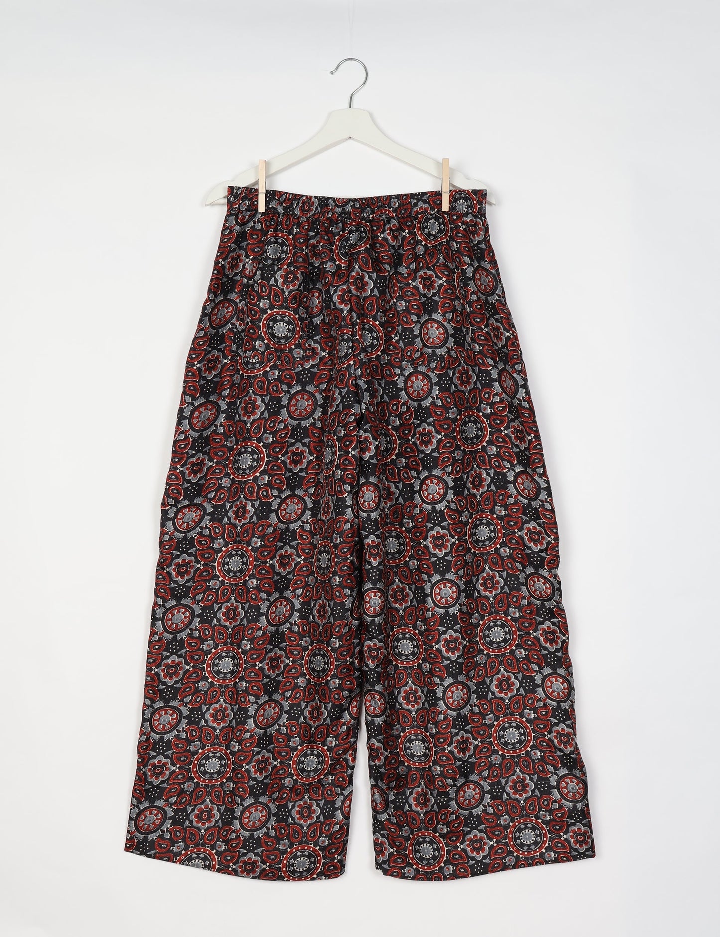 Upcycled women’s wide leg pants made from preloved saris, showcasing eco friendly clothes, zero waste clothing, and carbon neutral fashion.