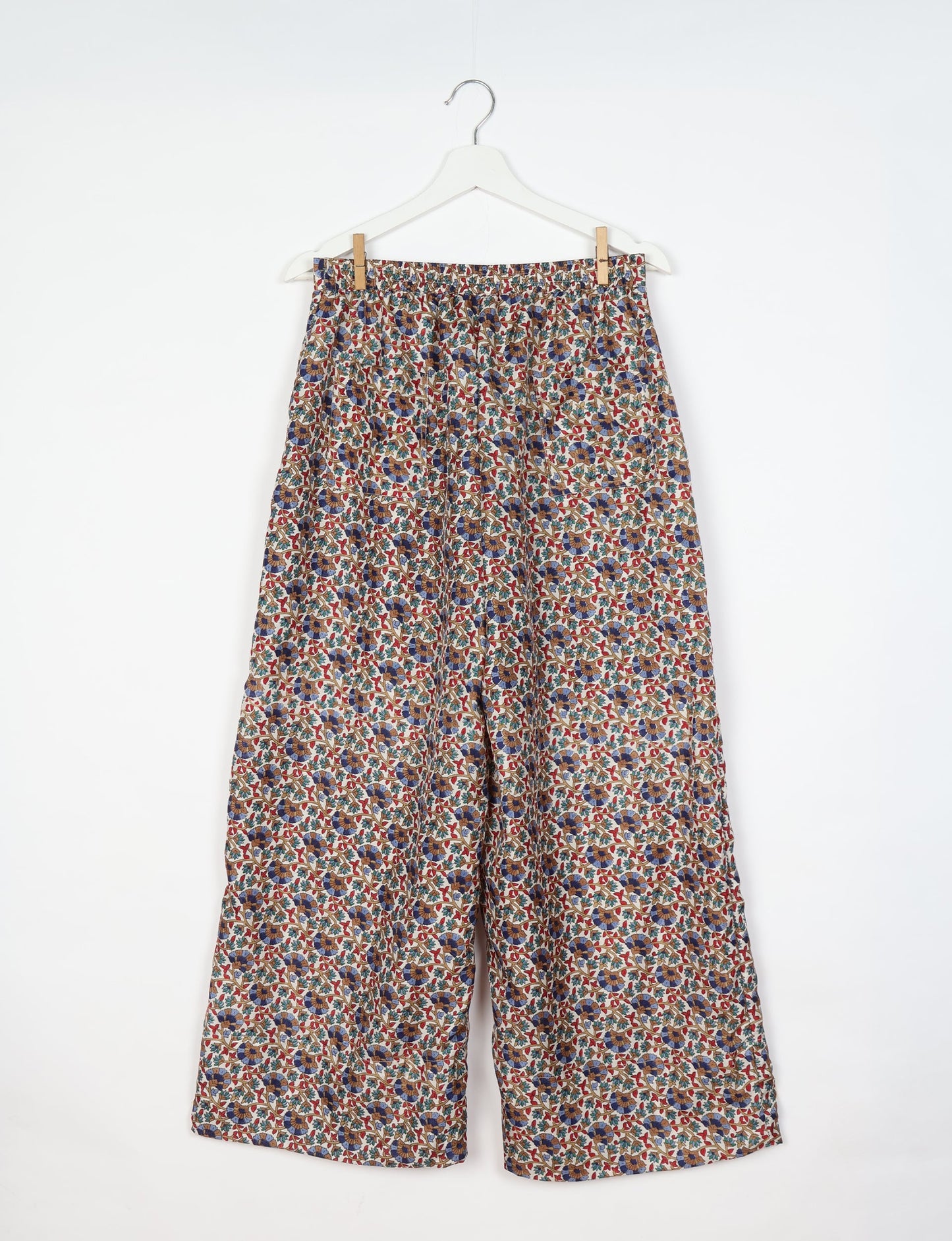 Upcycled women’s wide leg pants made from preloved saris, showcasing eco friendly clothes, zero waste clothing, and carbon neutral fashion.