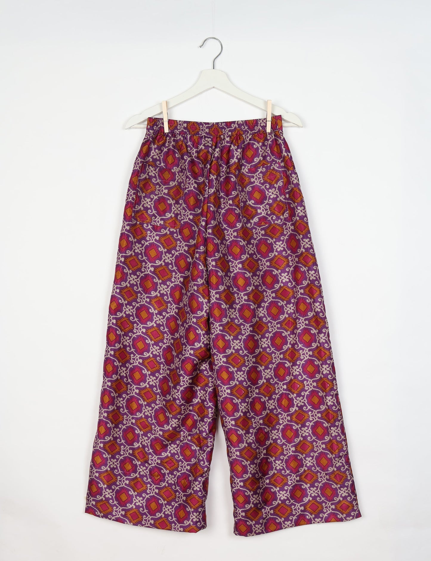 Upcycled women’s wide leg pants made from preloved saris, showcasing eco friendly clothes, zero waste clothing, and carbon neutral fashion.