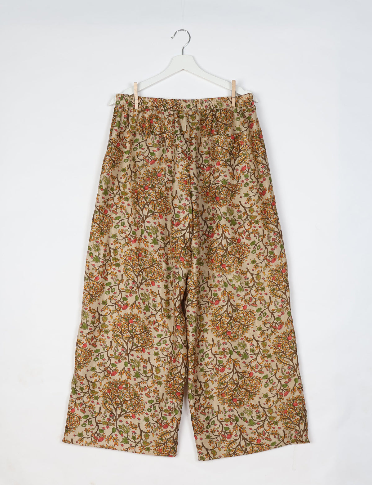 Upcycled women’s wide leg pants made from preloved saris, showcasing eco friendly clothes, zero waste clothing, and carbon neutral fashion.