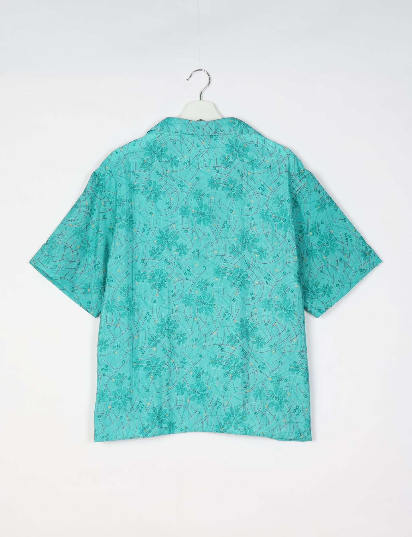 Oversized shirt made from recycled sari fabric, reflecting eco friendly fashion, repurposed clothing, and earth friendly clothing for conscious wardrobes.