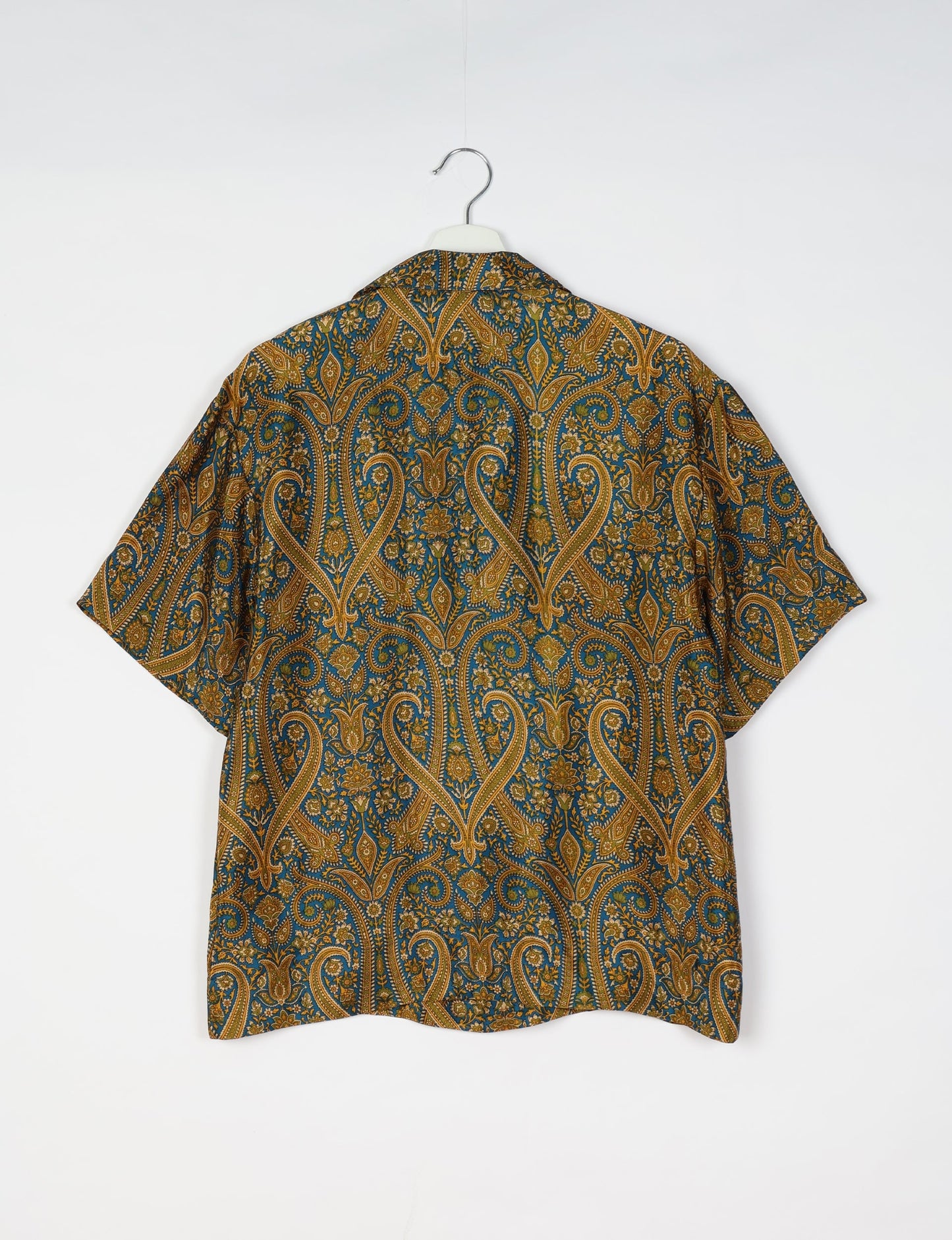 Oversized shirt made from recycled sari fabric, reflecting eco friendly fashion, repurposed clothing, and earth friendly clothing for conscious wardrobes.