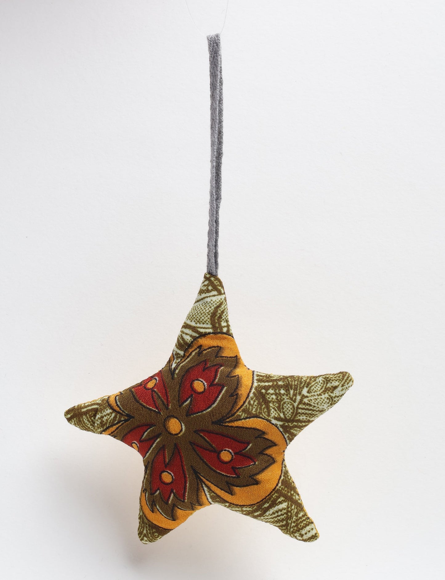 Hand-stitched mini star bauble made from recycled sari products, showcasing upcycled clothing techniques and eco friendly fashion. A lightweight festive accessory promoting conscious clothing, organic clothing, and sustainable women’s clothing crafted from recycled material clothing.