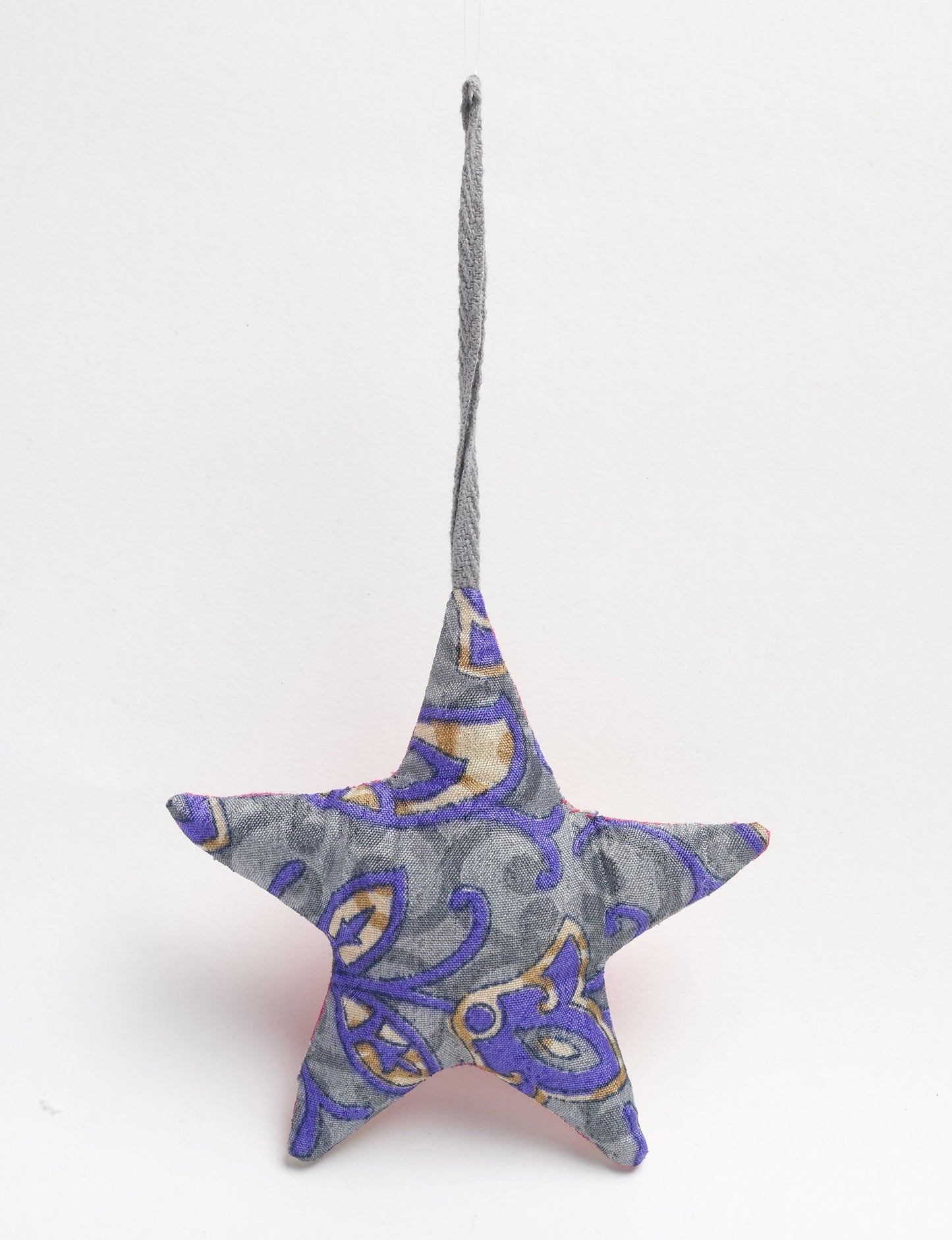 Hand-stitched mini star bauble made from recycled sari products, showcasing upcycled clothing techniques and eco friendly fashion. A lightweight festive accessory promoting conscious clothing, organic clothing, and sustainable women’s clothing crafted from recycled material clothing.