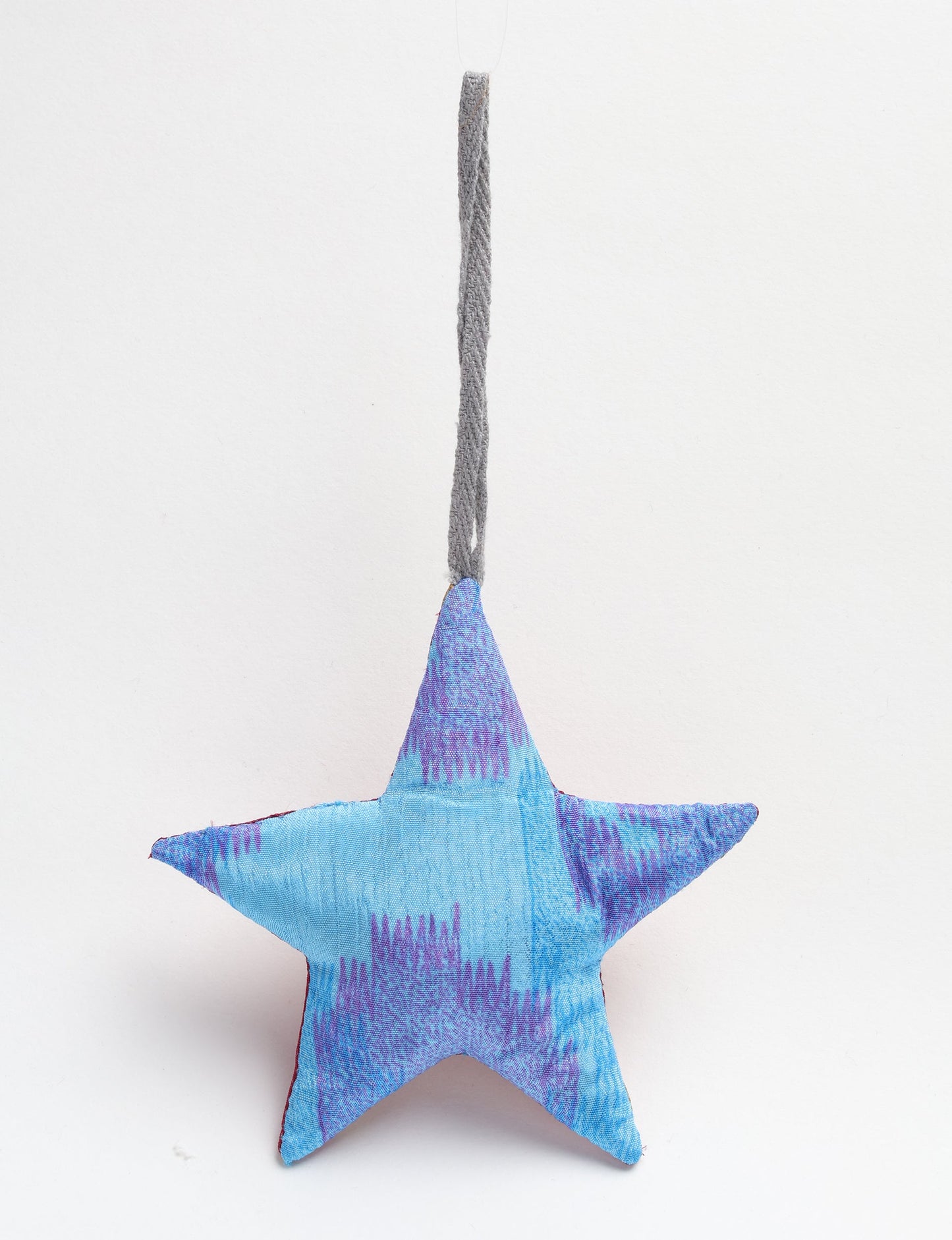 Hand-stitched mini star bauble made from recycled sari products, showcasing upcycled clothing techniques and eco friendly fashion. A lightweight festive accessory promoting conscious clothing, organic clothing, and sustainable women’s clothing crafted from recycled material clothing.