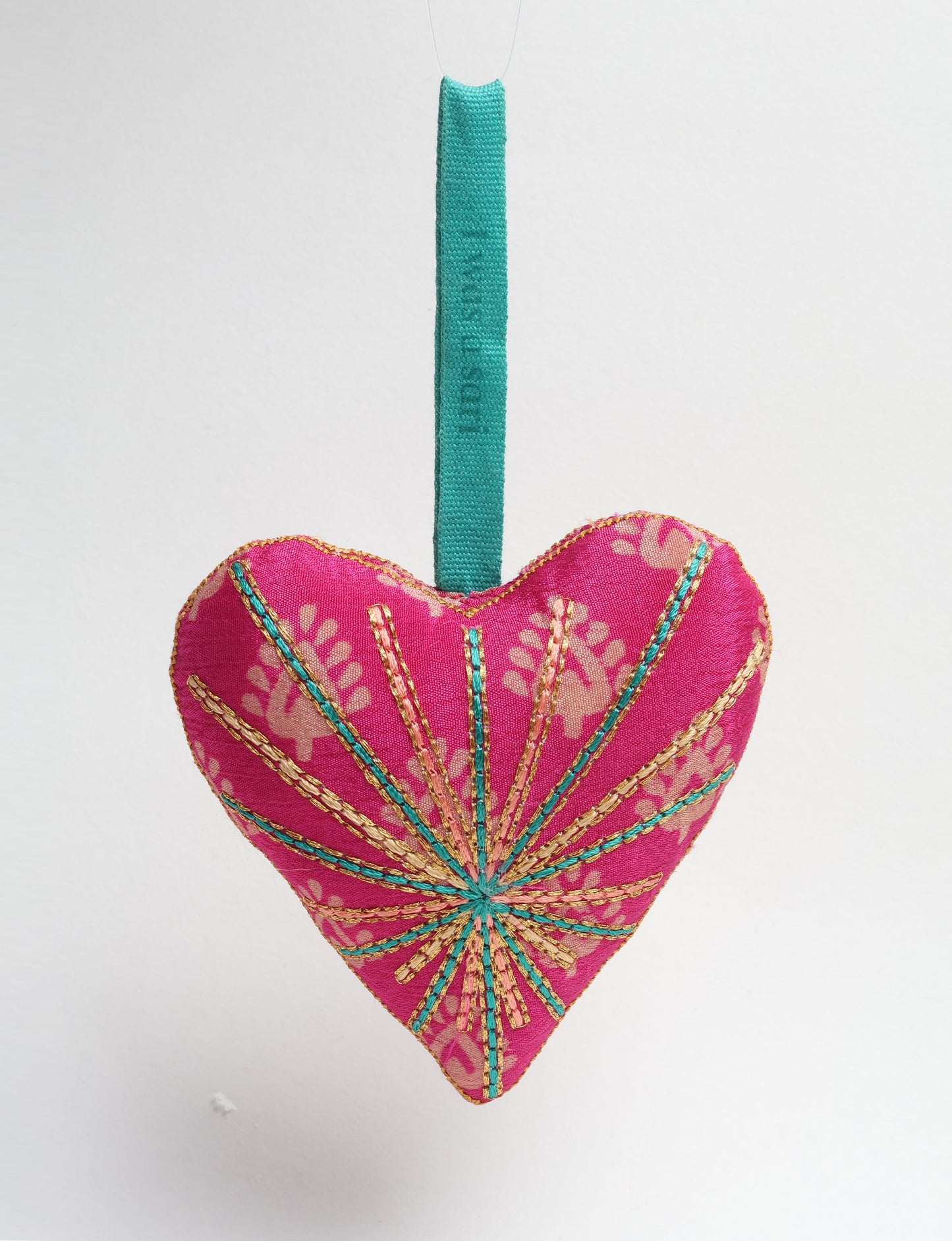 Timeless Heart ornament made from upcycled clothing and recycled fabric, filled with organic cotton and hand-finished with vibrant silk and metallic thread. An eco-friendly, carbon neutral fashion piece that supports green fashion and fair trade apparel.
