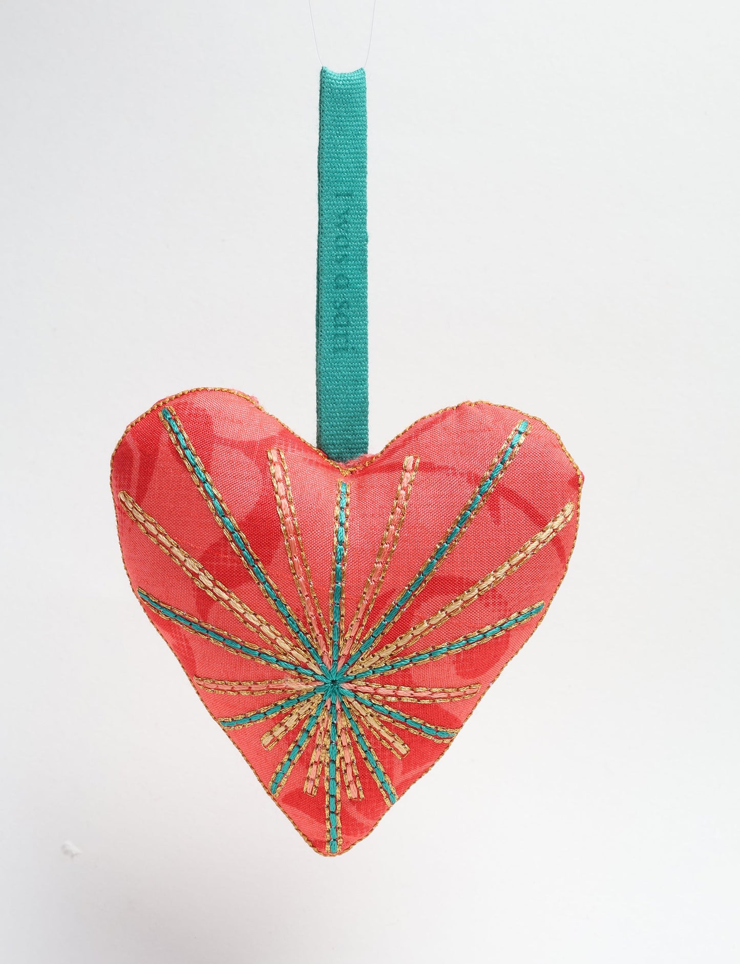 Timeless Heart ornament made from upcycled clothing and recycled fabric, filled with organic cotton and hand-finished with vibrant silk and metallic thread. An eco-friendly, carbon neutral fashion piece that supports green fashion and fair trade apparel.