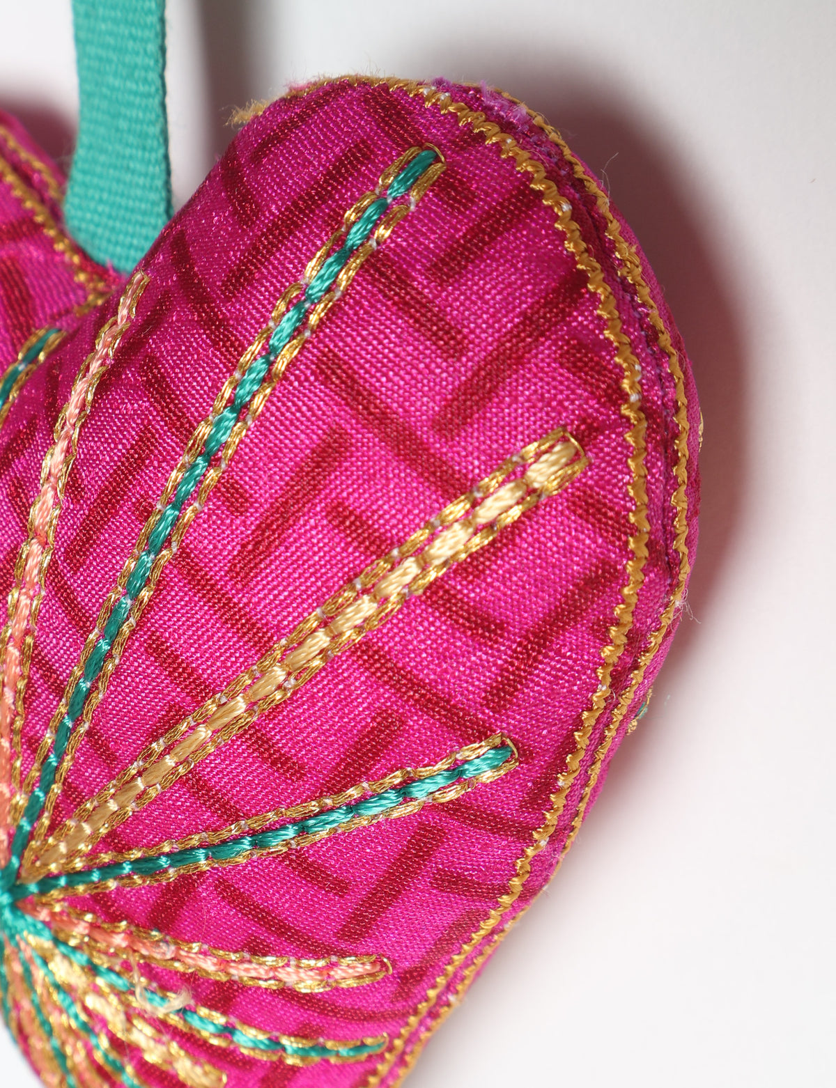 Timeless Heart ornament made from upcycled clothing and recycled fabric, filled with organic cotton and hand-finished with vibrant silk and metallic thread. An eco-friendly, carbon neutral fashion piece that supports green fashion and fair trade apparel.