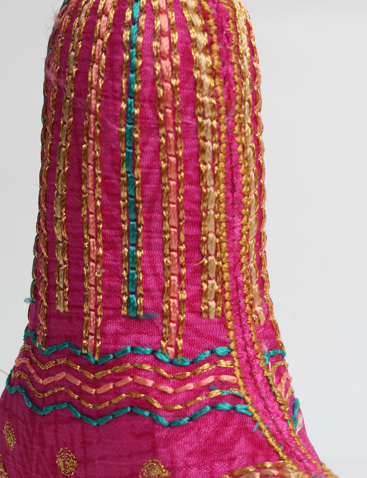 Upcycled sari bell ornament with hand embroidery and organic cotton filling ā upcycled clothing, recycled sari products, eco clothing, recycled sustainable fashion, green fashion, repurposed clothing, earth friendly clothing, and conscious clothing accessory for sustainable women's clothing collections.