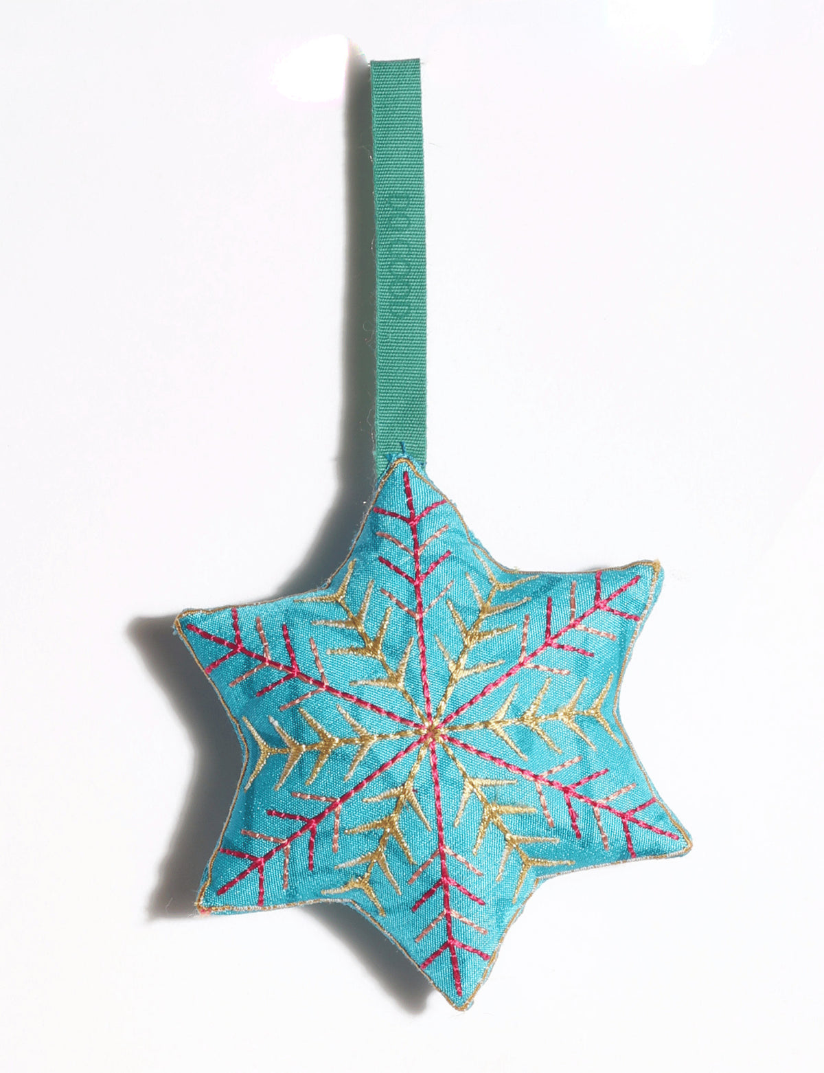 Handcrafted snowflake Christmas ornament made from preloved saris with silk and metallic gold thread embroidery