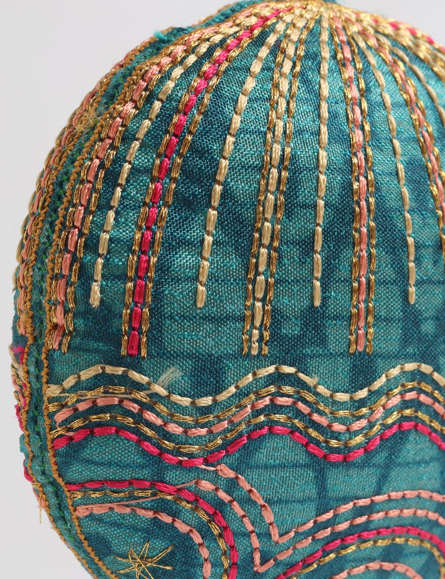 Timeless Full Moon ornament handmade from recycled sari fabric, featuring organic cotton filling and gold thread embroidery — a beautiful piece of upcycled clothing, eco clothing, and sustainable women’s fashion made from repurposed materials.