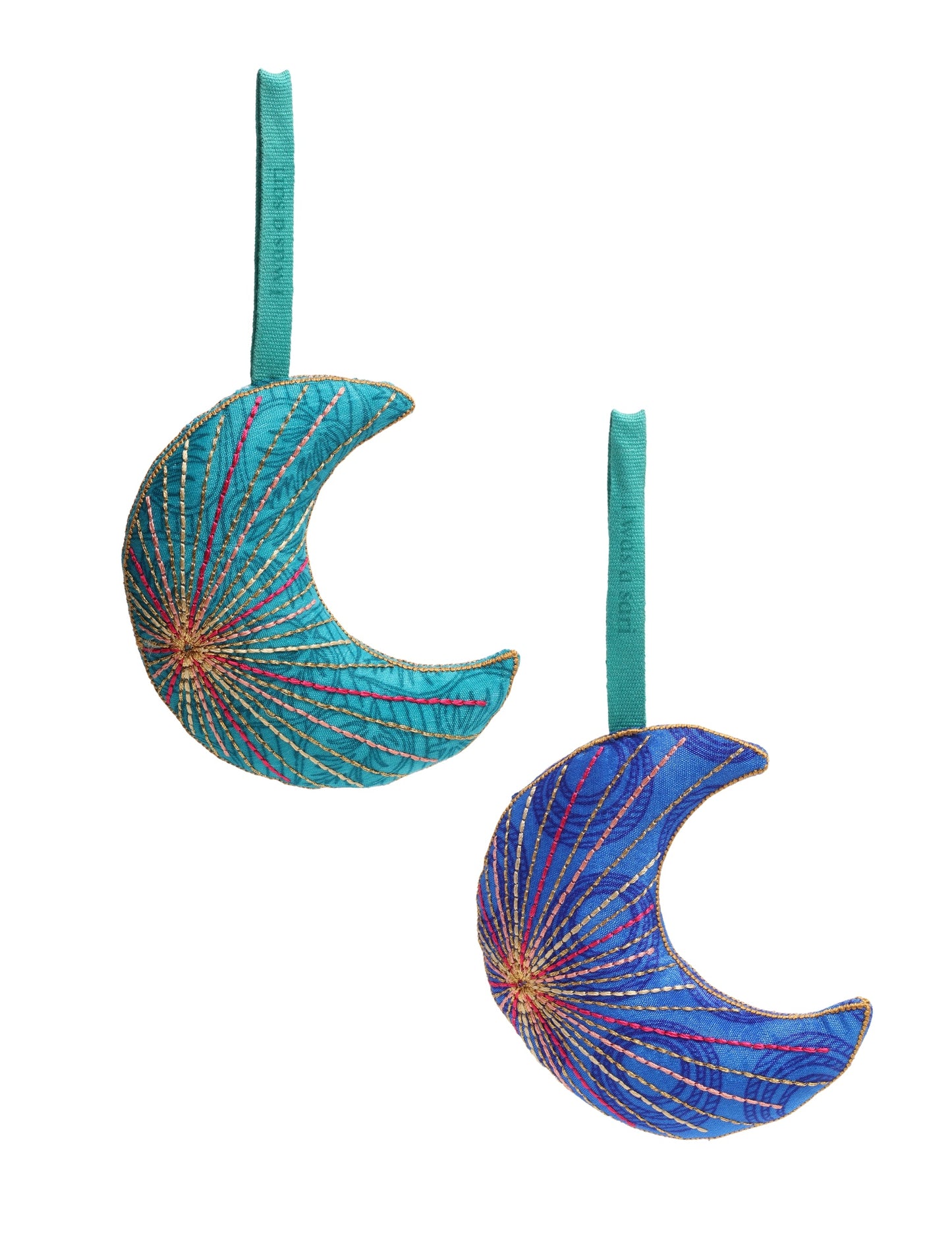 Timeless crescent moon ornament made from recycled materials and textile waste, featuring intricate embroidery. A zero waste and carbon offset accessory that supports circular fashion, fair trade fashion, and environmentally friendly clothing choices.