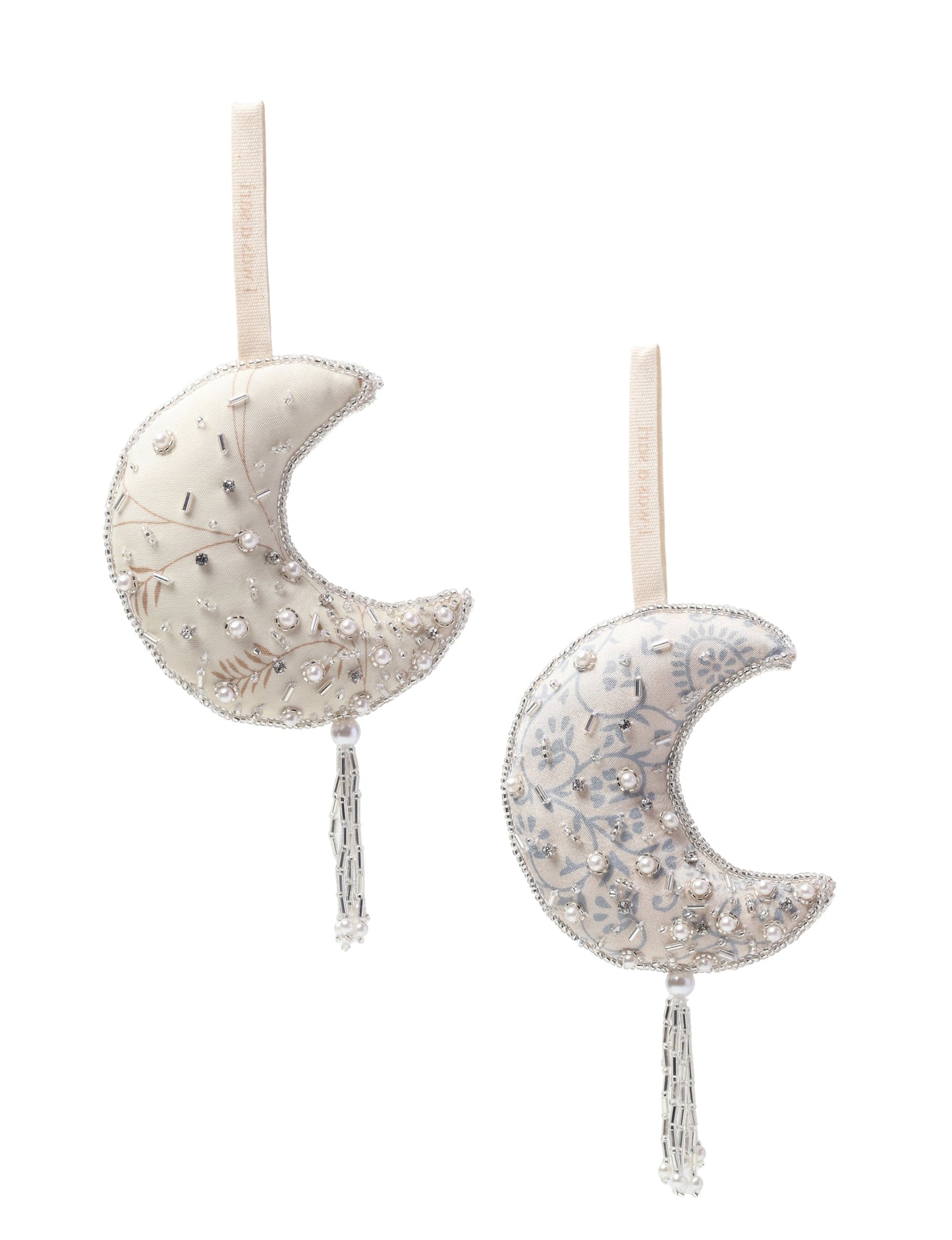 Crescent moon ornament made from recycled clothing, featuring fair trade fashion, clothes made from recycled fabric, and upcycled garments with elegant silver embellishments and tassel, ideal for those who value climate neutral clothing and recycled sustainable fashion.