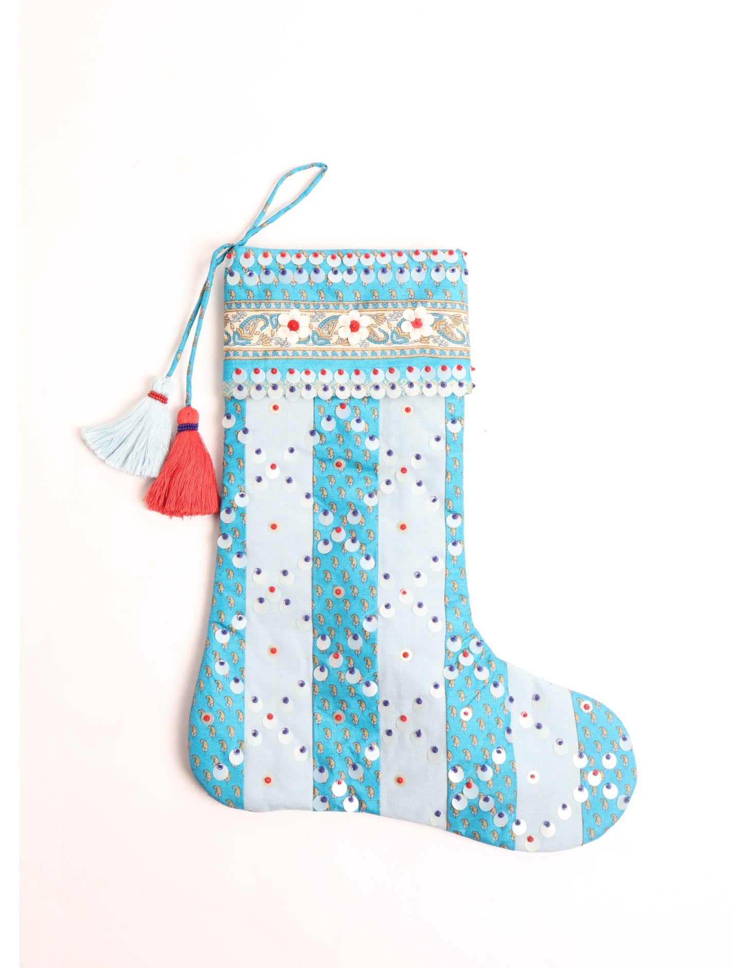 Upcycled sari Christmas stocking with striped cotton accents and hand-embroidered embellishments, reflecting green fashion, zero-waste clothing, recycled fashion, repurposed clothing, carbon-neutral fashion, natural clothing, conscious clothing, and sustainable women’s clothing.