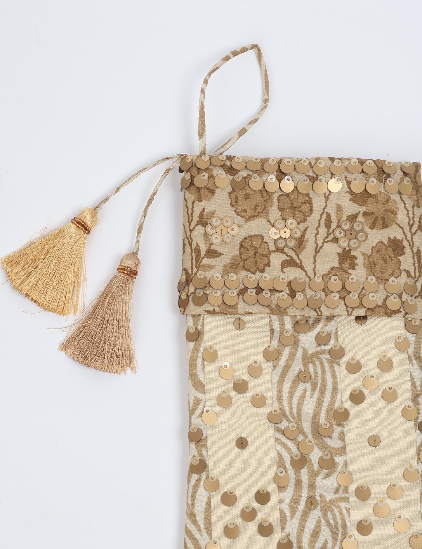 Upcycled sari Christmas stocking in ivory and cream tones with striped cotton detailing and gold embroidery; handmade eco clothing piece representing conscious clothing, recycled fashion, sustainable apparel, and fair trade fashion craftsmanship.