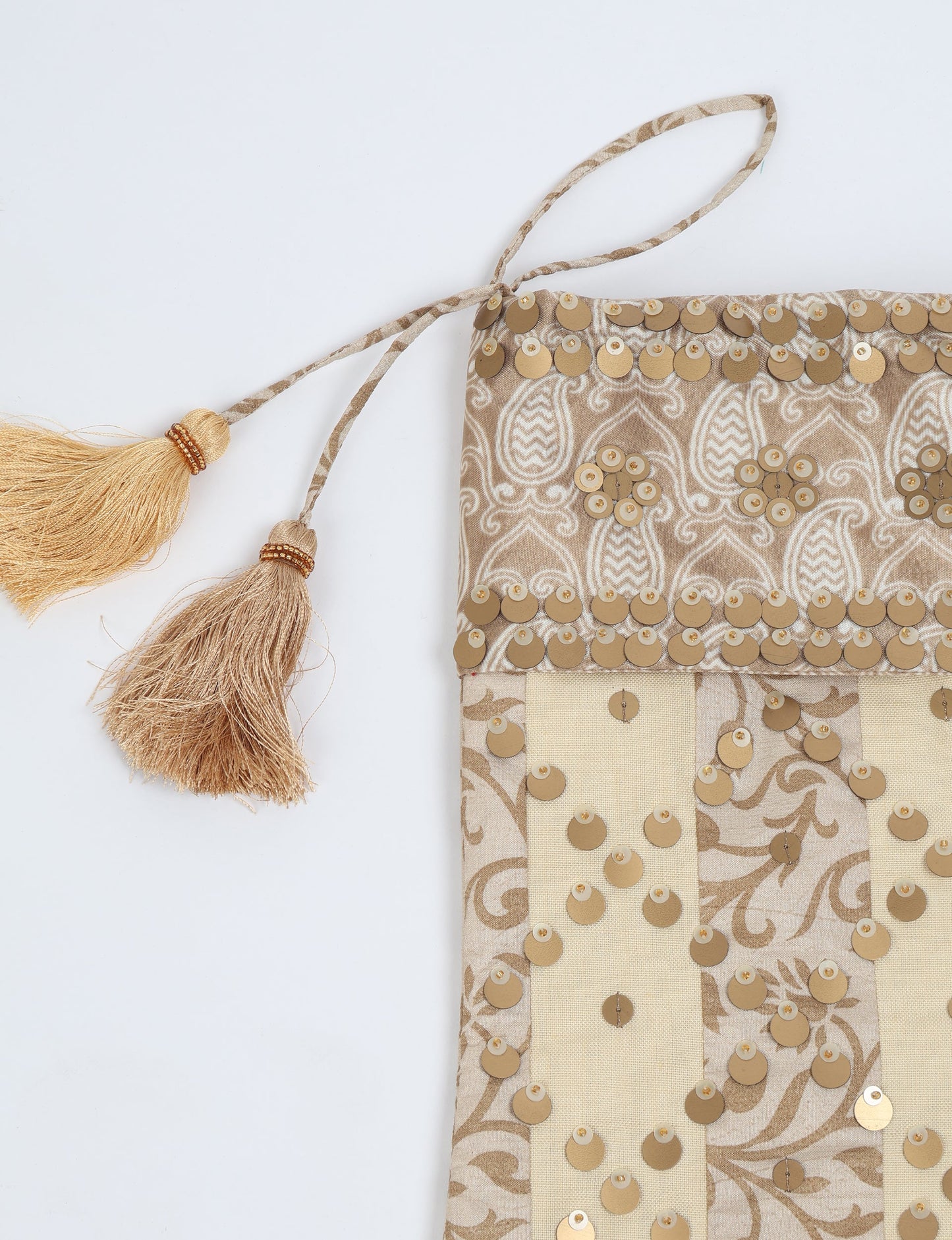 Upcycled sari Christmas stocking in ivory and cream tones with striped cotton detailing and gold embroidery; handmade eco clothing piece representing conscious clothing, recycled fashion, sustainable apparel, and fair trade fashion craftsmanship.