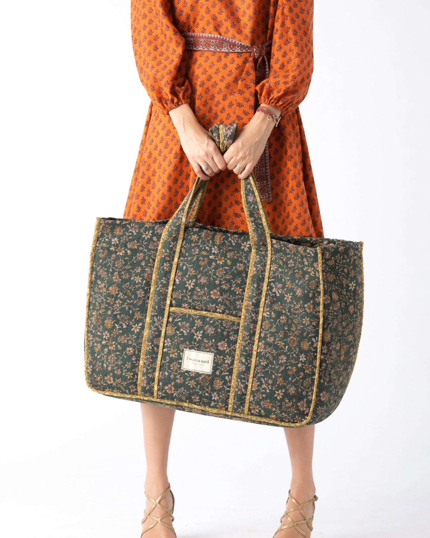 Quilted work tote bag with structured rectangular design and long shoulder straps, representing slow fashion and ethical clothing ideals, made as part of upcycled women's clothing and sustainable women's clothing using recycled fashion and earth friendly clothing practices.