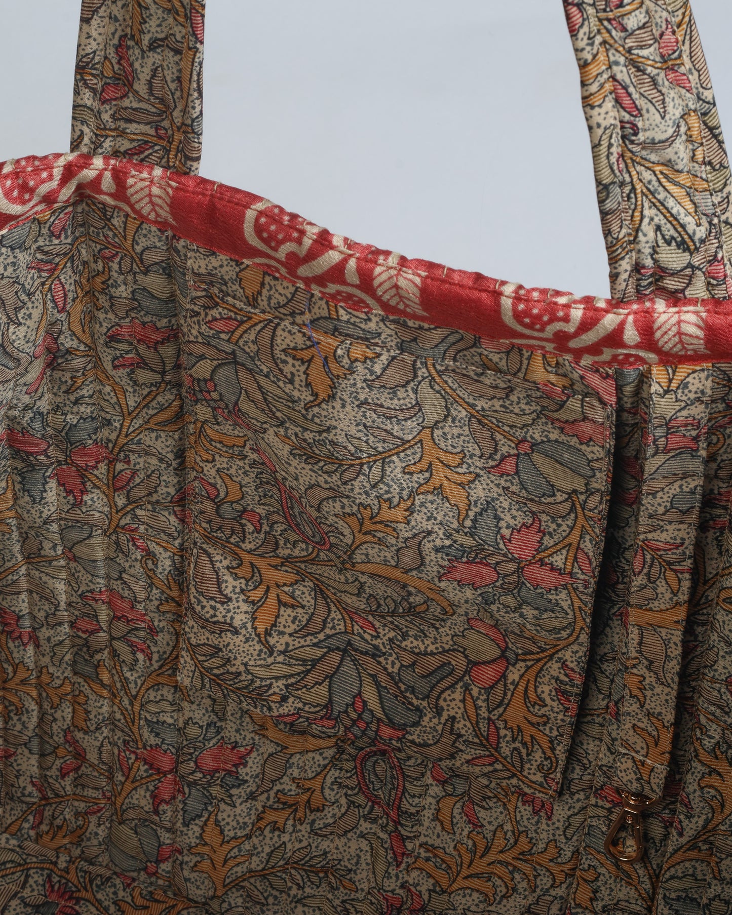 Quilted work tote bag with structured rectangular design and long shoulder straps, representing slow fashion and ethical clothing ideals, made as part of upcycled women's clothing and sustainable women's clothing using recycled fashion and earth friendly clothing practices.