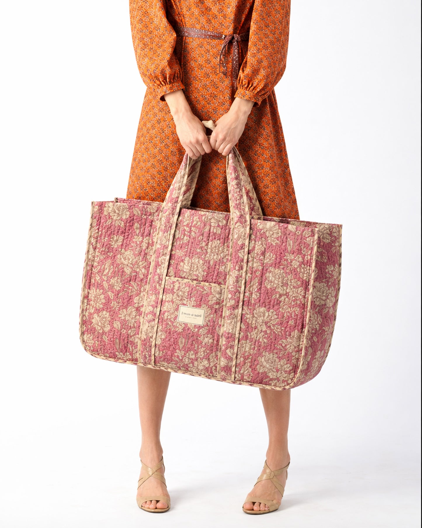 Quilted work tote bag with structured rectangular design and long shoulder straps, representing slow fashion and ethical clothing ideals, made as part of upcycled women's clothing and sustainable women's clothing using recycled fashion and earth friendly clothing practices.