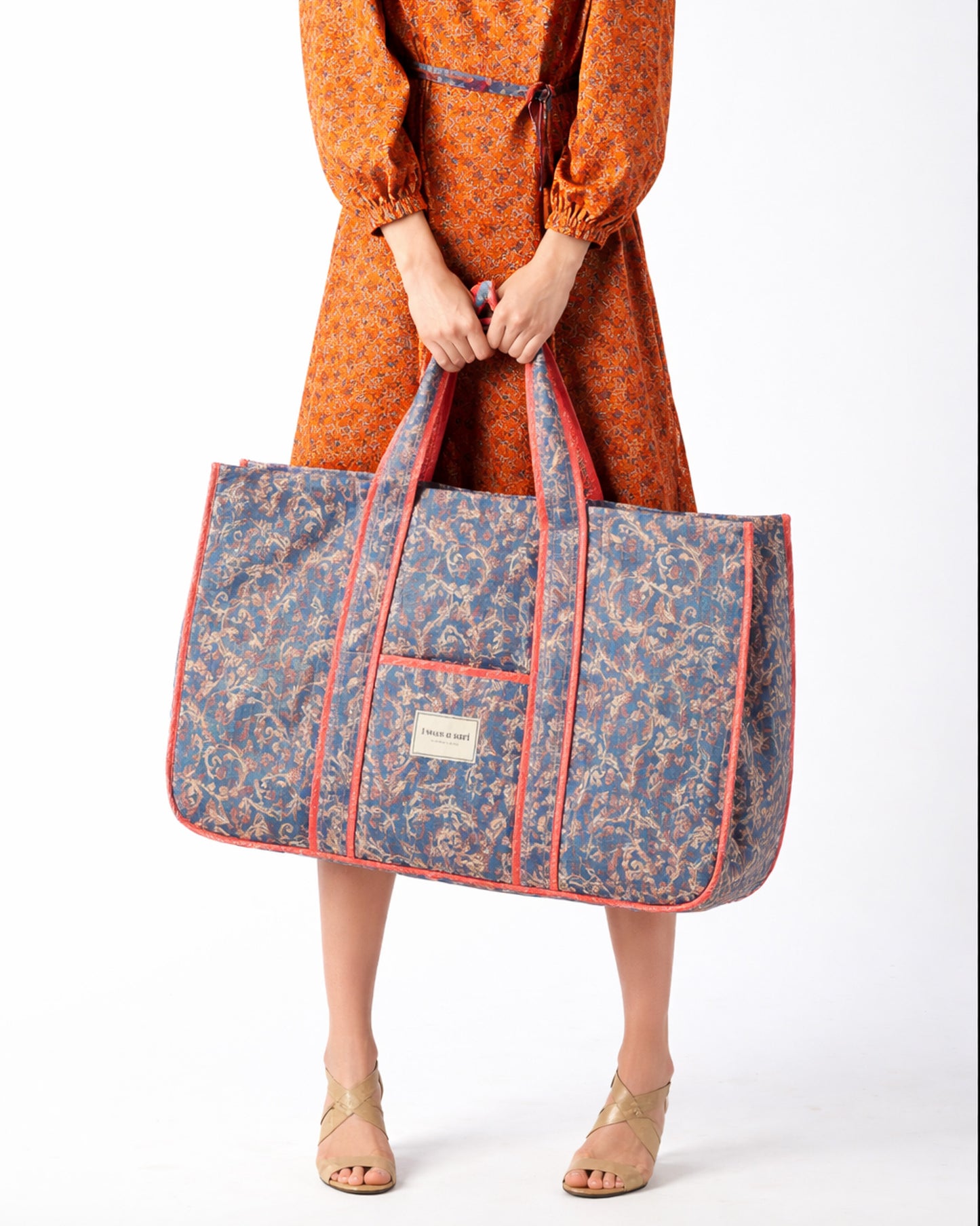 Quilted work tote bag with structured rectangular design and long shoulder straps, representing slow fashion and ethical clothing ideals, made as part of upcycled women's clothing and sustainable women's clothing using recycled fashion and earth friendly clothing practices.