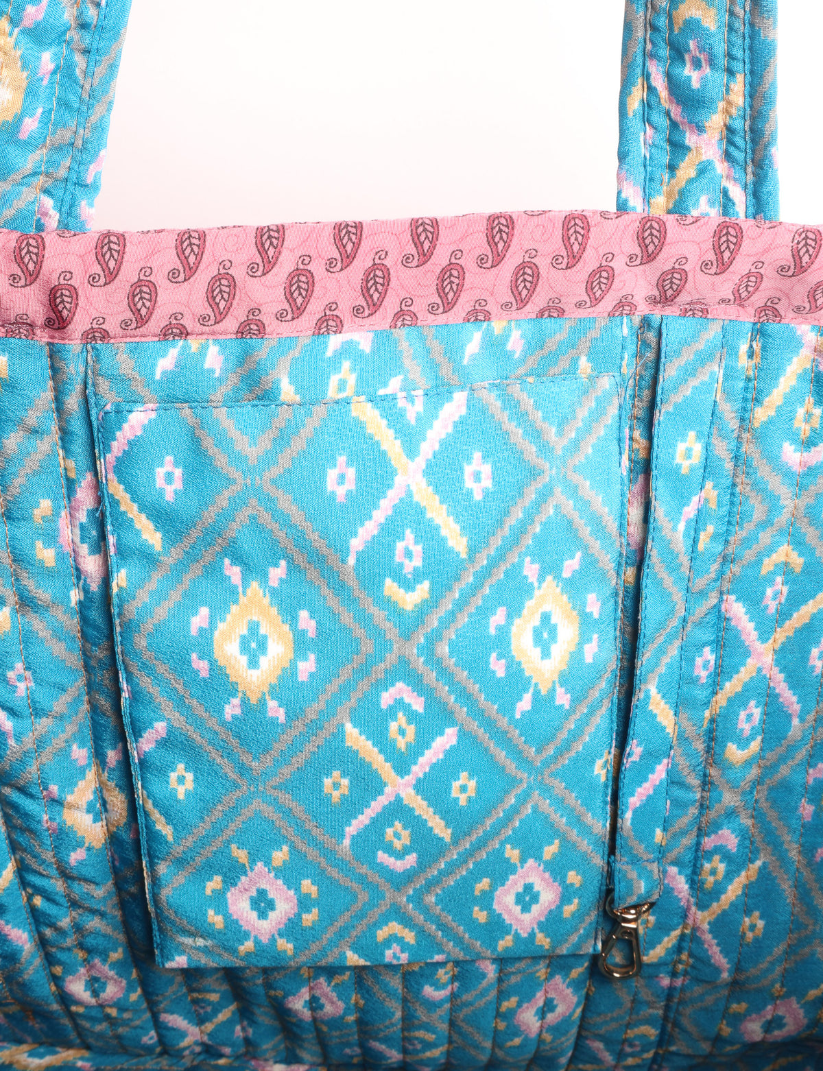 Quilted work tote bag with structured rectangular design and long shoulder straps, representing slow fashion and ethical clothing ideals, made as part of upcycled women's clothing and sustainable women's clothing using recycled fashion and earth friendly clothing practices.