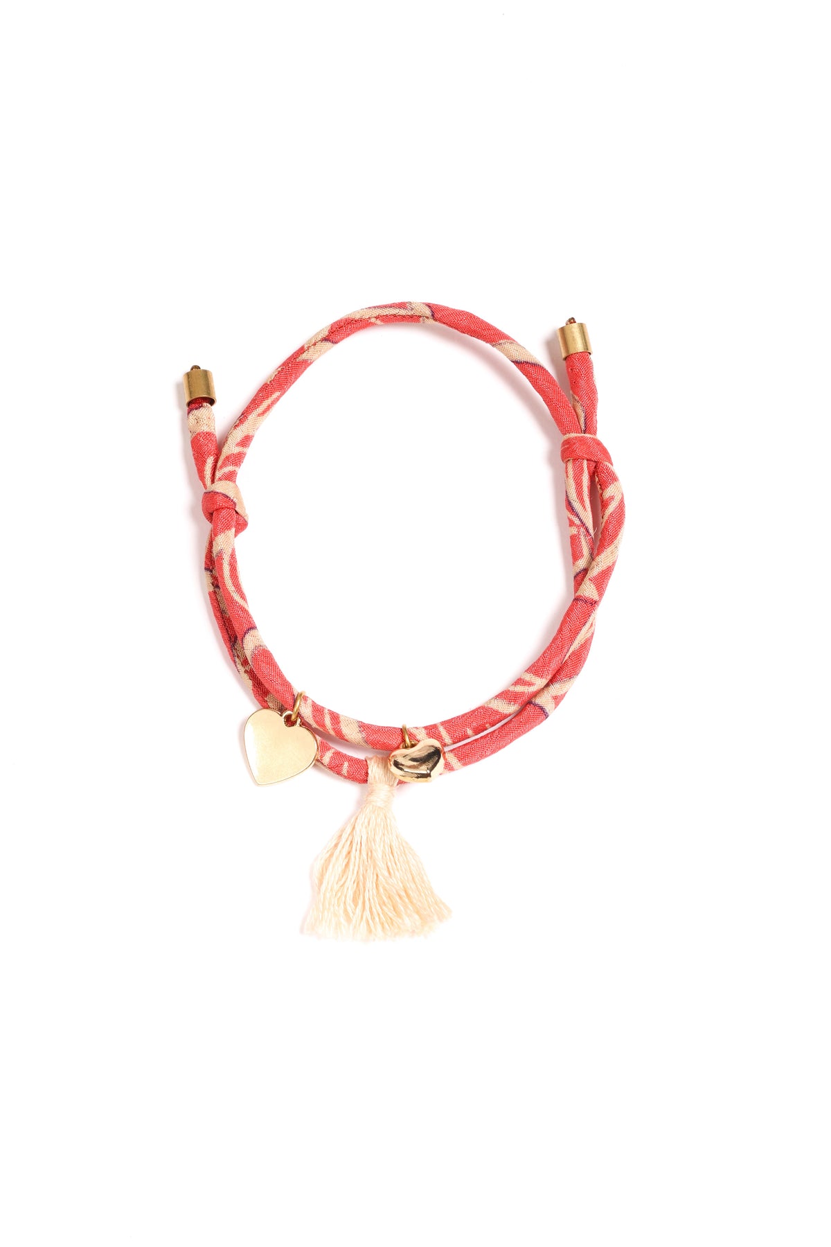 A handcrafted Heart Rope Bracelet made from upcycled sari fabric, featuring a dainty heart charm and a soft tassel. This upcycled women's clothing accessory represents circular fashion, recycled sustainable fashion, and slow fashion, aligning with the fashion revolution. A perfect blend of eco friendly fashion and conscious clothing, designed to support sustainable apparel and empower artisans.